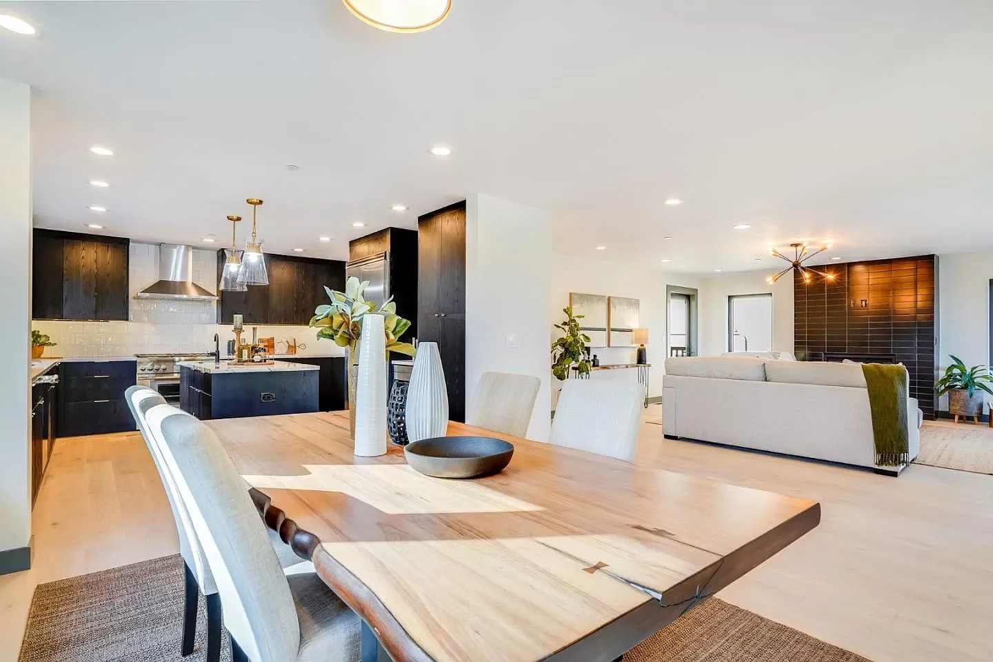 Engineered open living-dining-kitchen connection with concealed structural beams