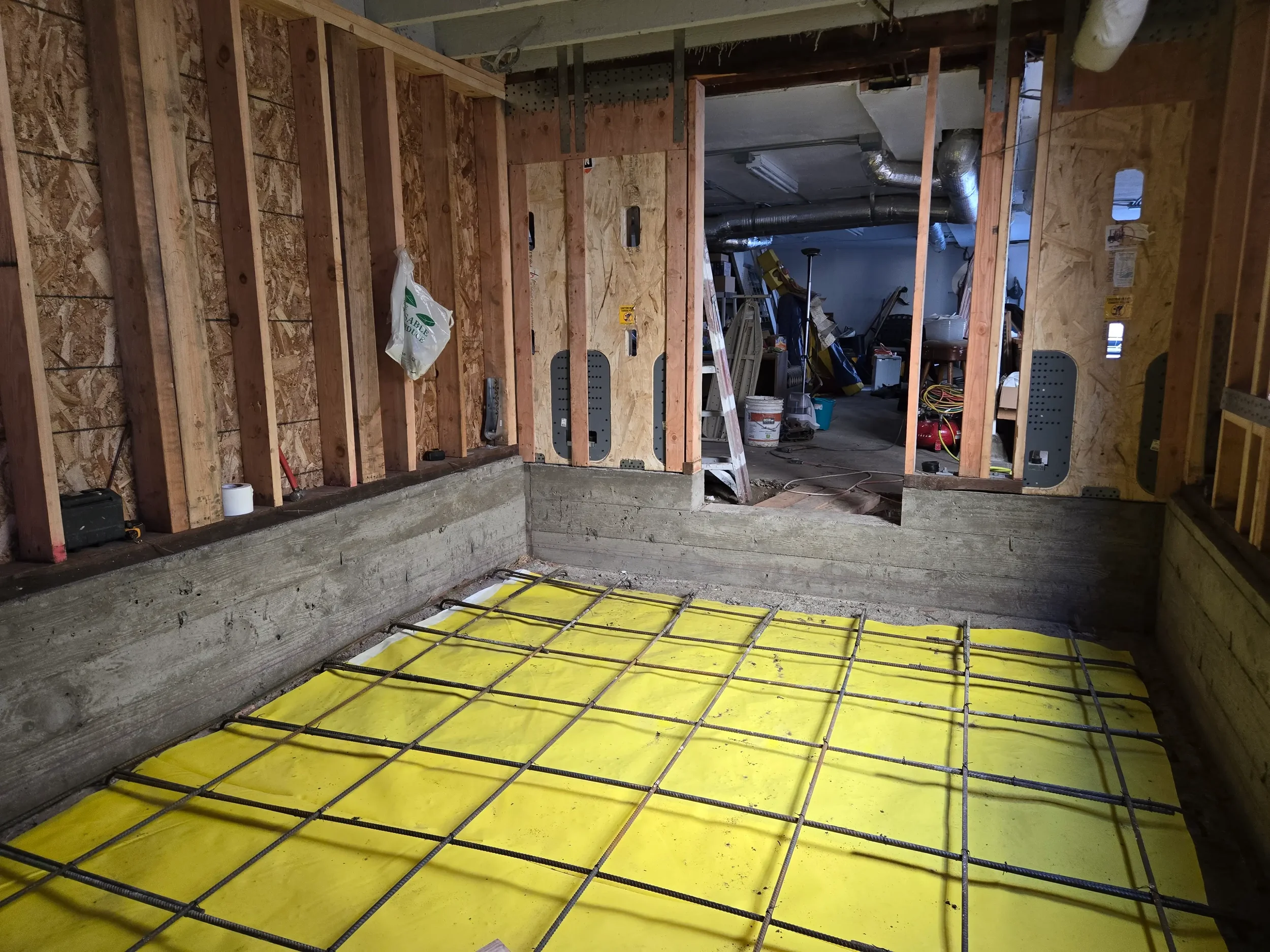 Rebar placement and prep for slab and roof deck framing, part of structural design by Massoudi Consulting Engineers