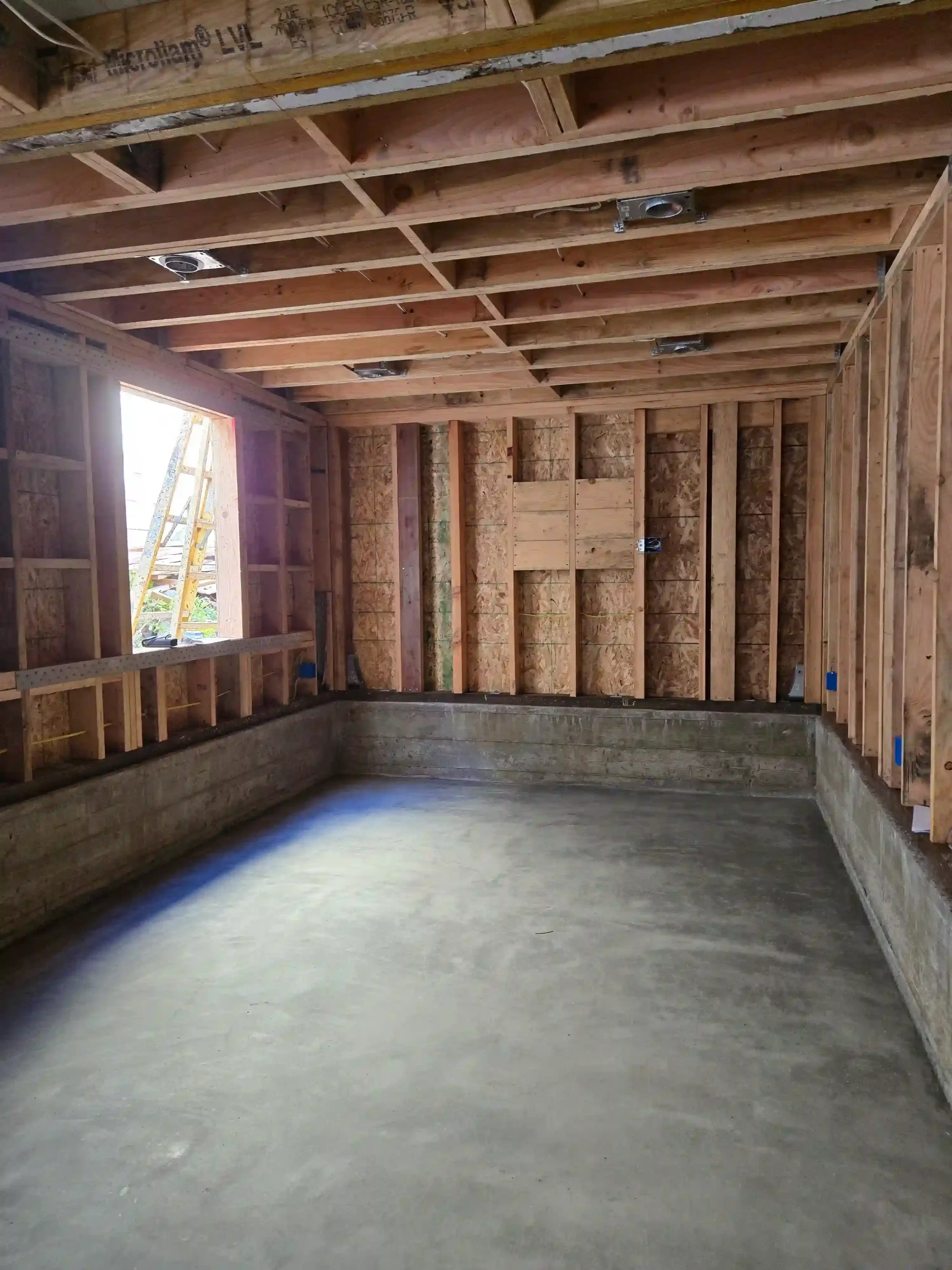 Open bay with engineered concrete foundation and wall framing by Massoudi Consulting Engineers in the Bay Area