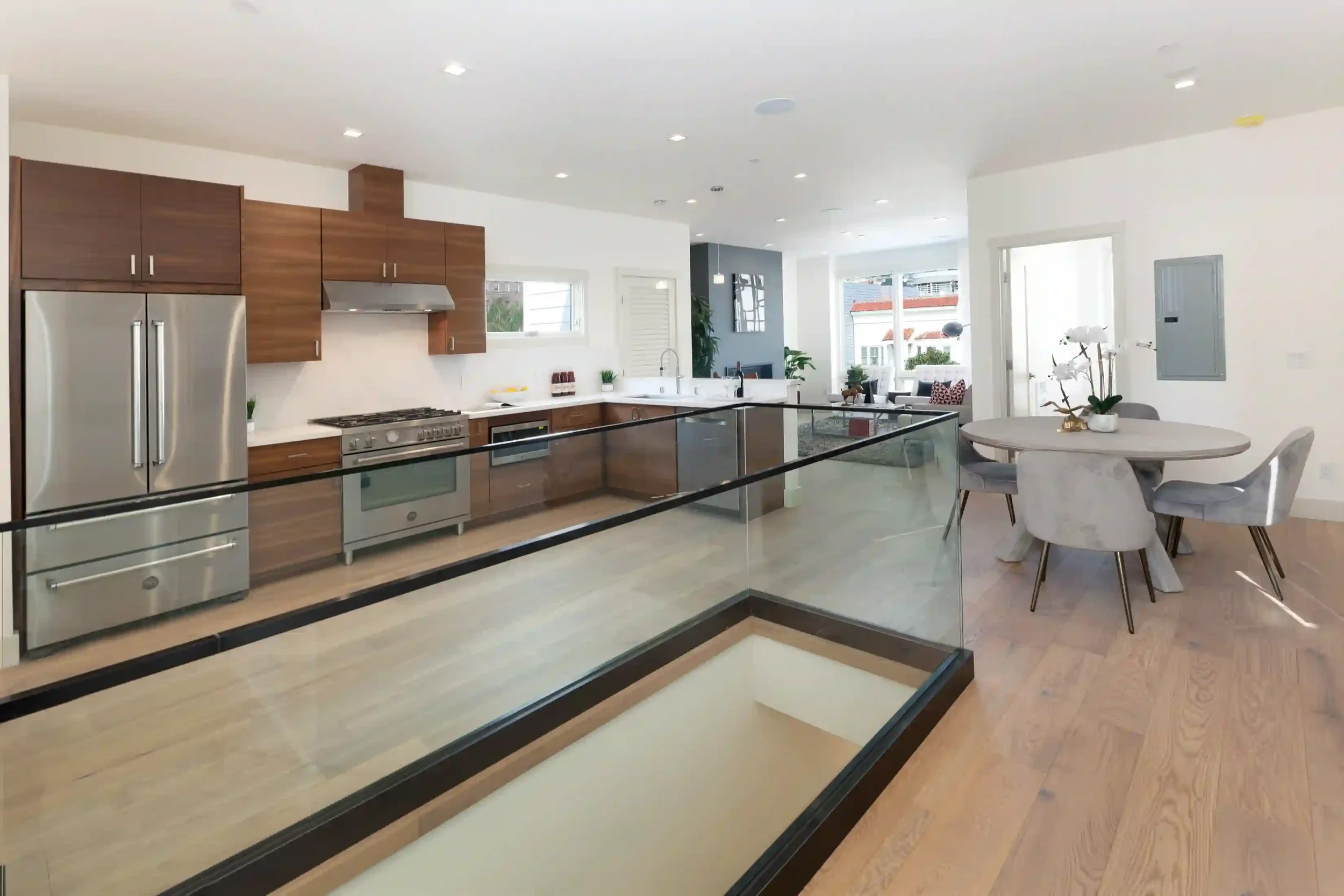 Kitchen remodel with reconfigured walls and plumbing coordinated with structural design