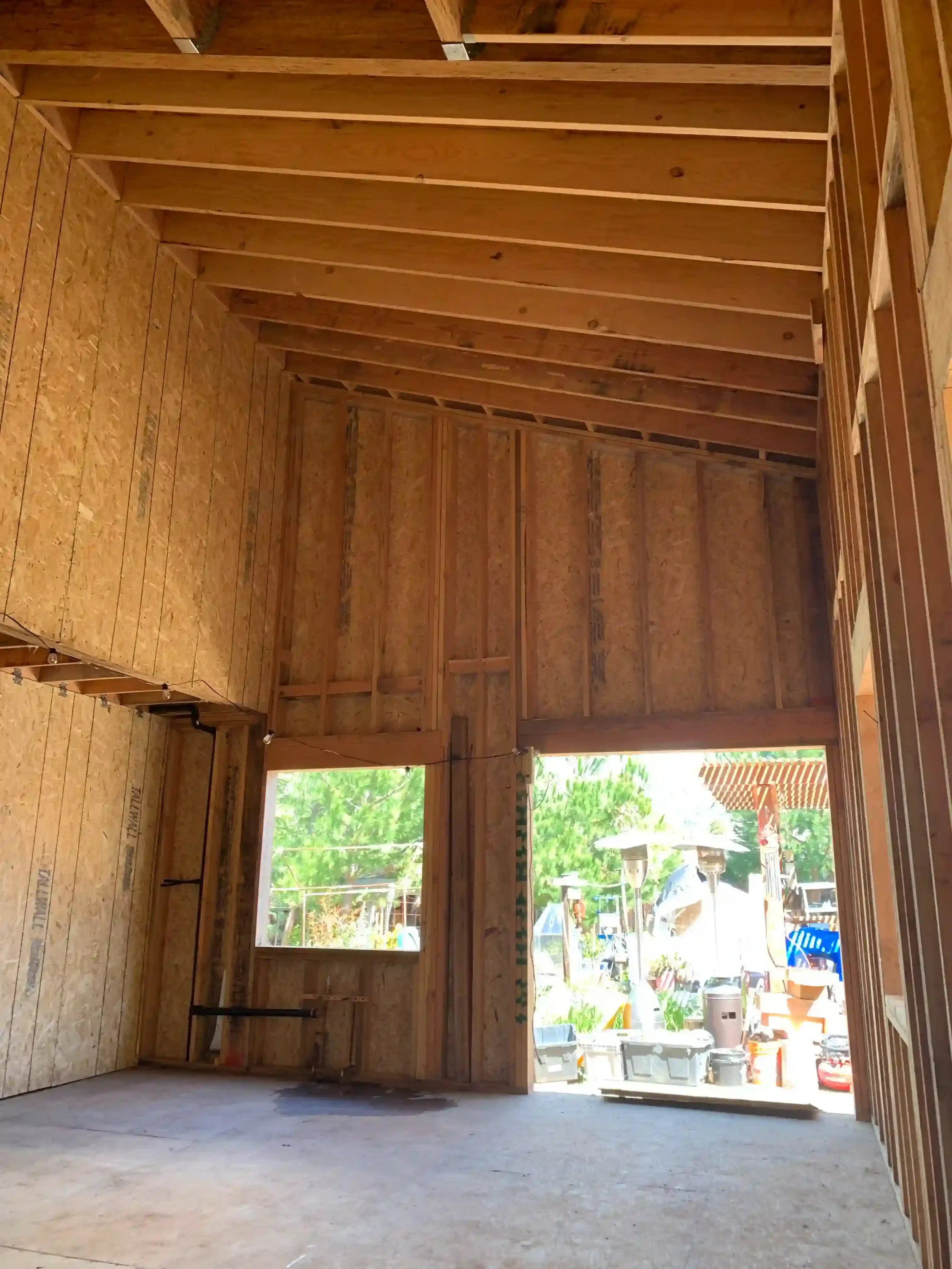 Double-height framed opening in modern ADU designed for structural stability by Massoudi Consulting Engineers