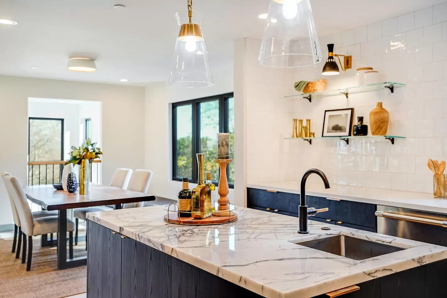 Kitchen and dining area featuring engineered support for wide window openings
