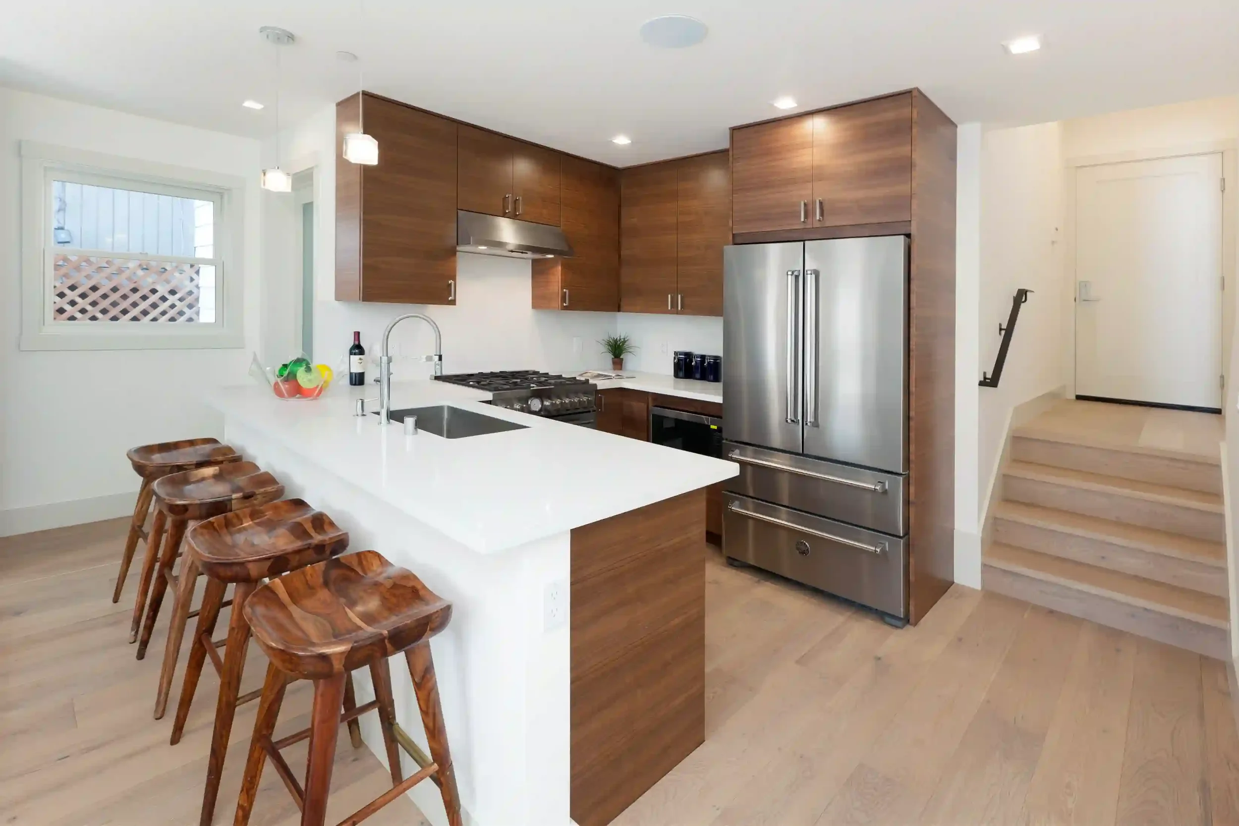 Efficient kitchen layout designed with structural wall removals and architectural integration