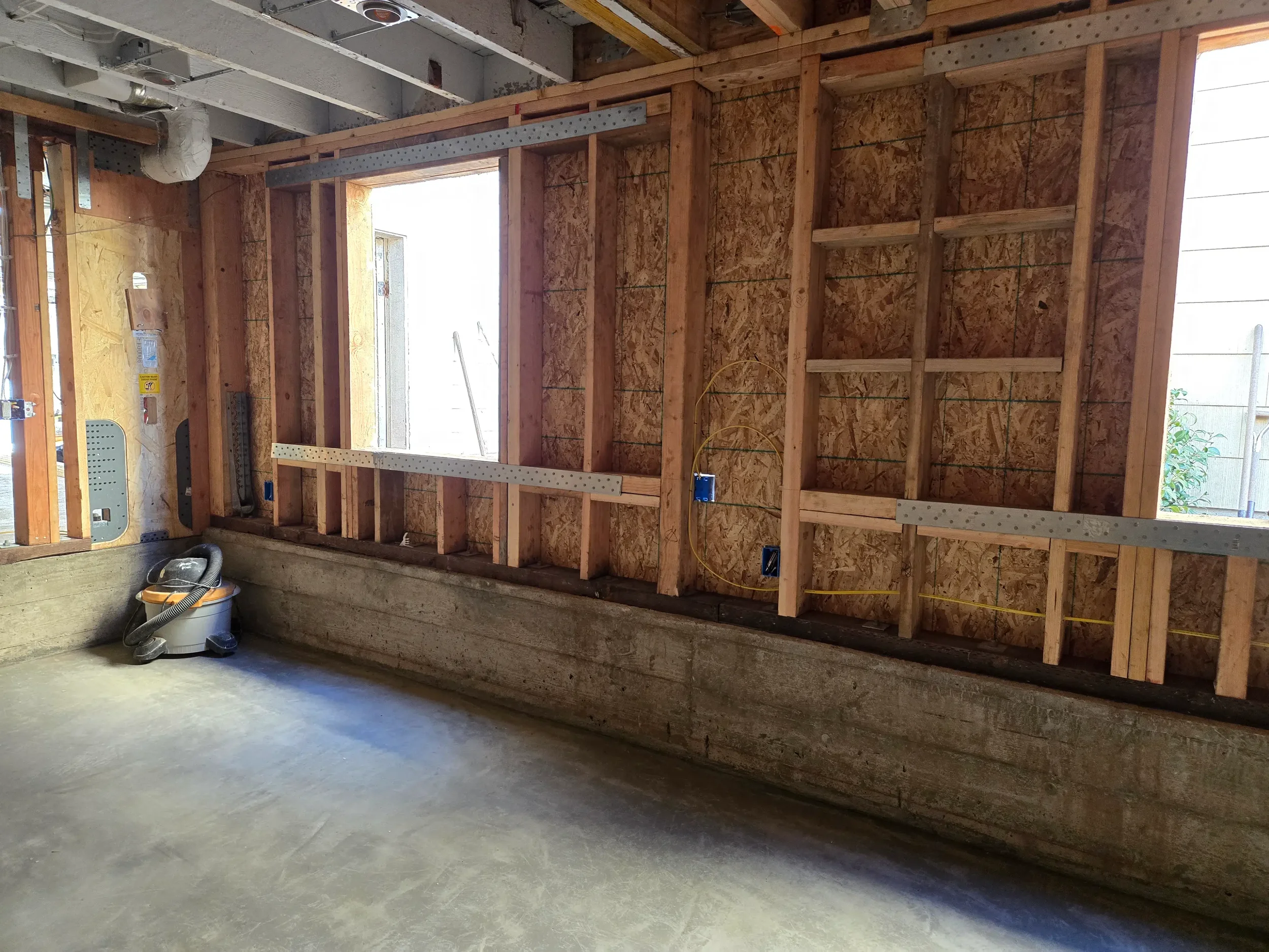 Open bay with engineered concrete foundation and wall framing by Massoudi Consulting Engineers in the Bay Area