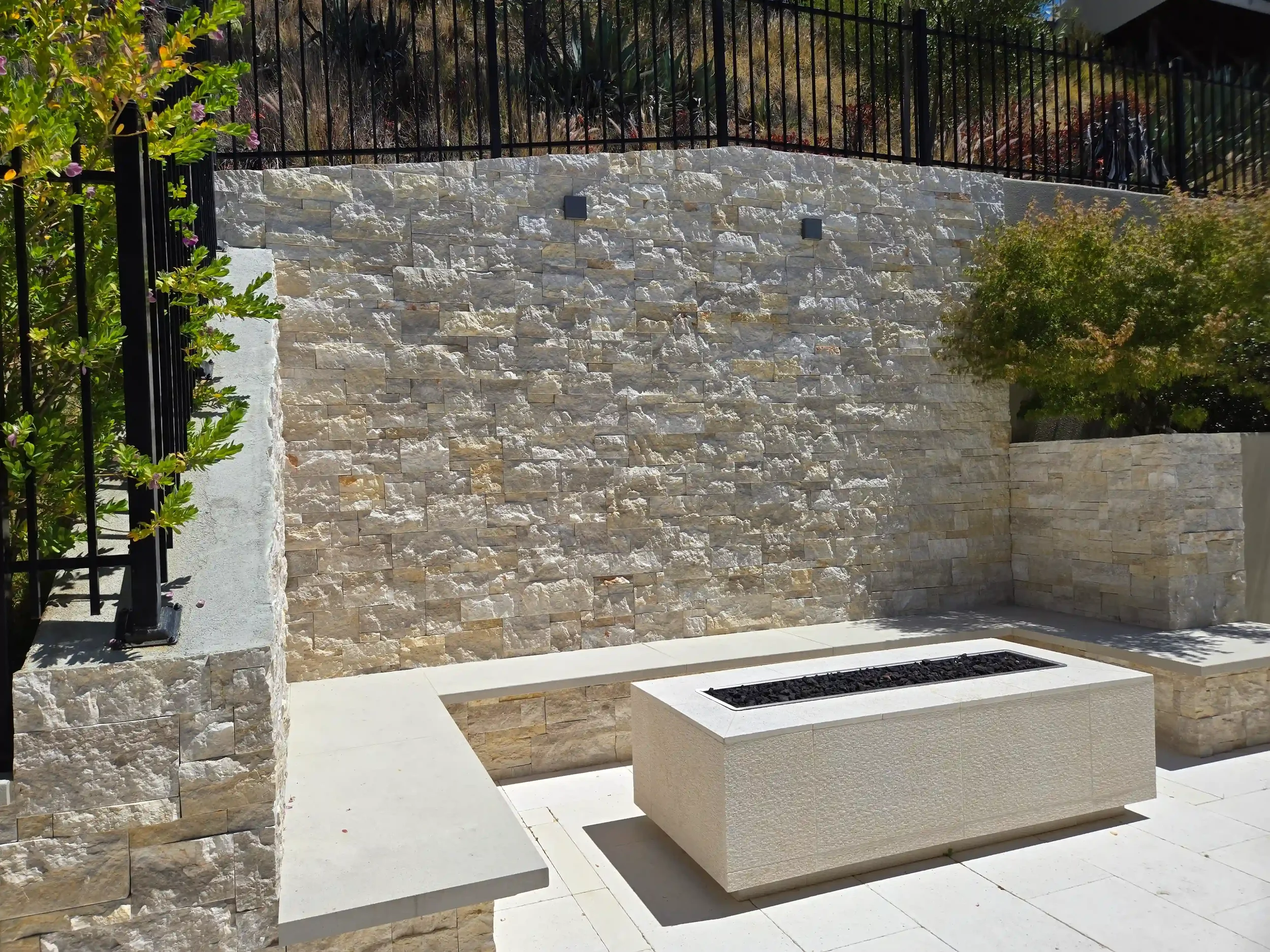 Close-up of retaining wall designed by Massoudi Consulting Engineers, highlighting civil engineering expertise in reinforced concrete structures and drainage management.