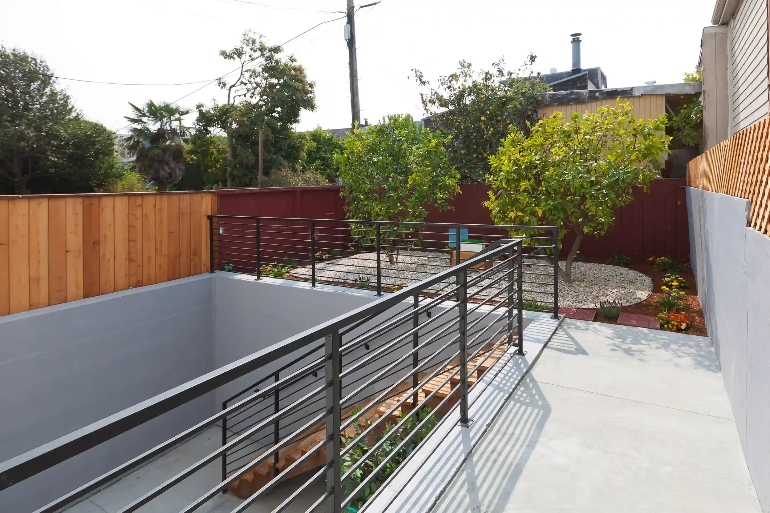 Rear yard with retaining walls and engineered drainage layout in San Francisco
