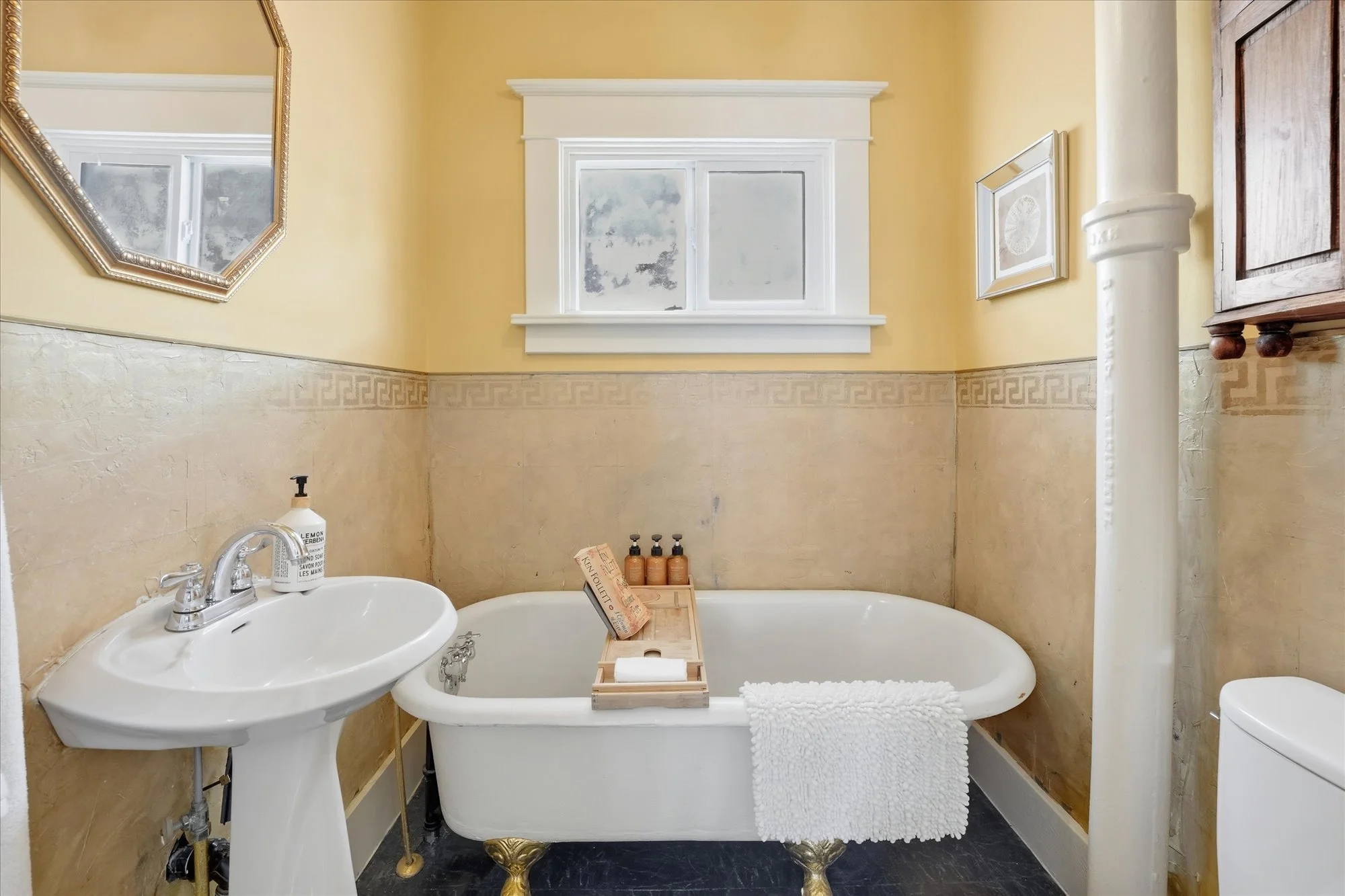 the original bathroom is situated right next to the bedroom.
