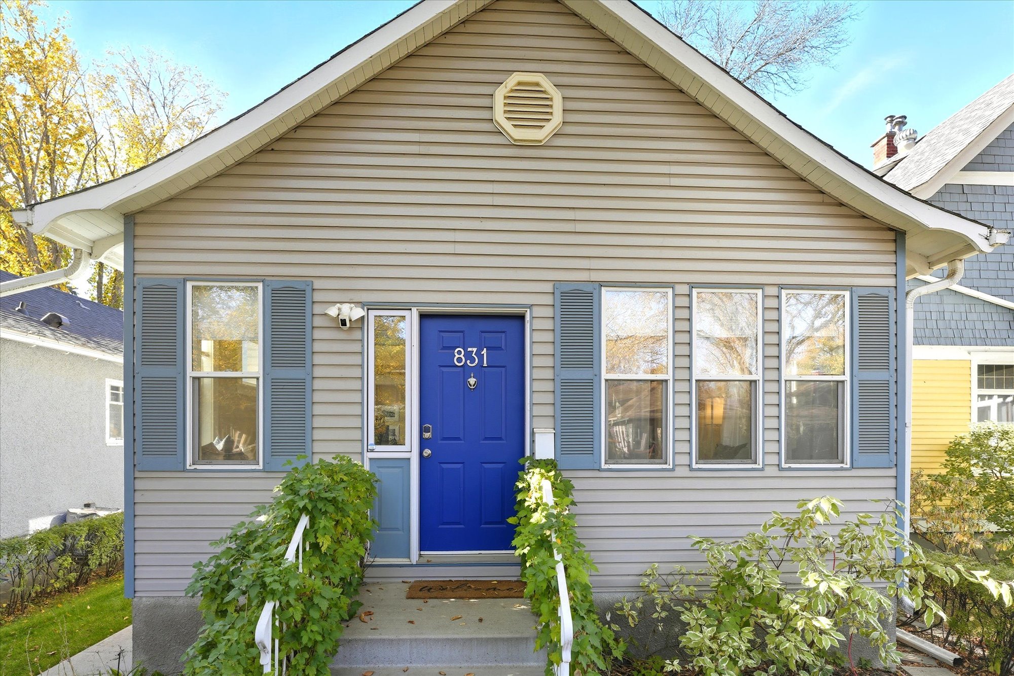 located close to downtown, the character home stands out with the brilliant blue front door.