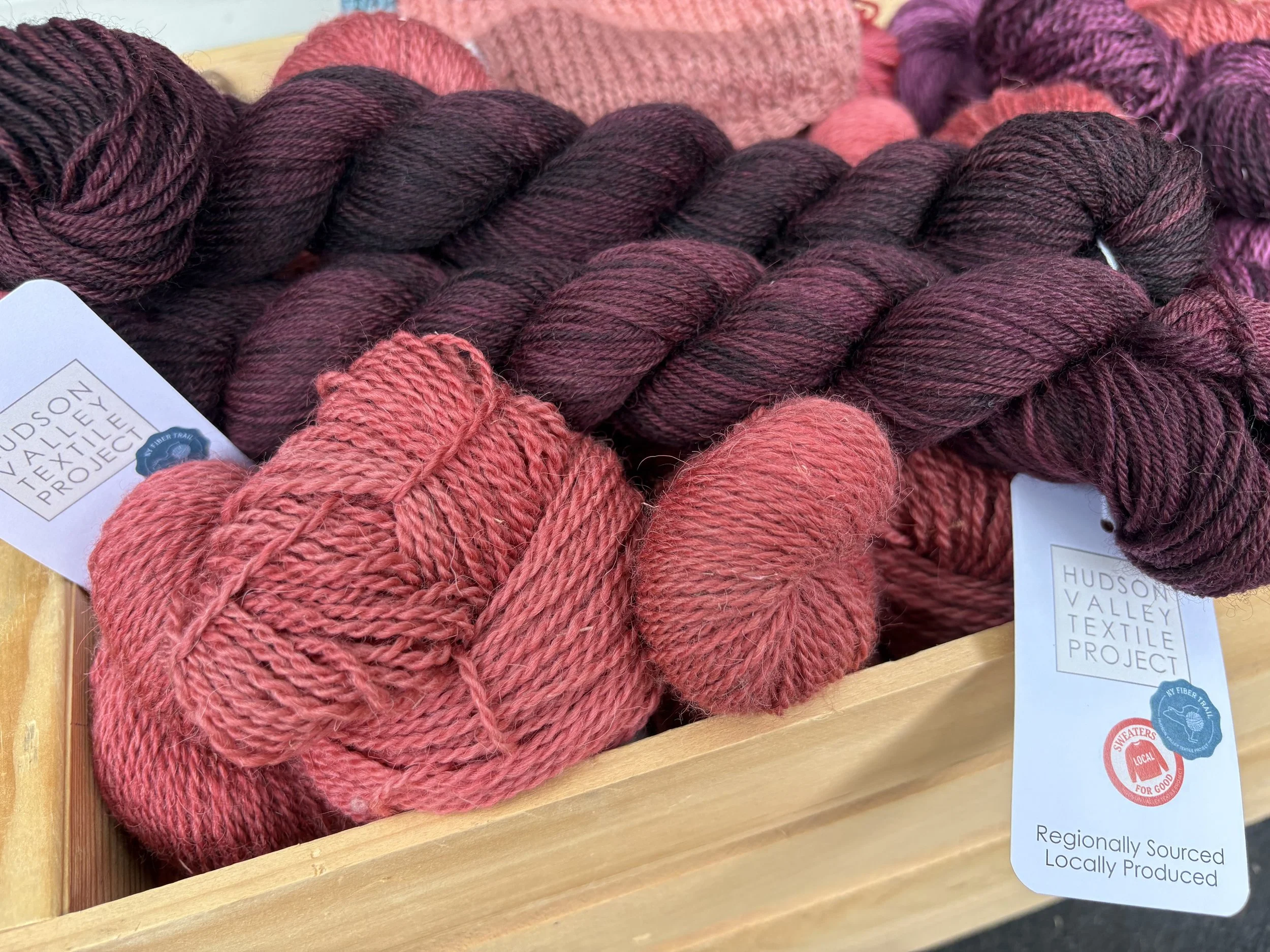 HVTP's Saratoga DK Weight Yarn in plum and watermelon color.
