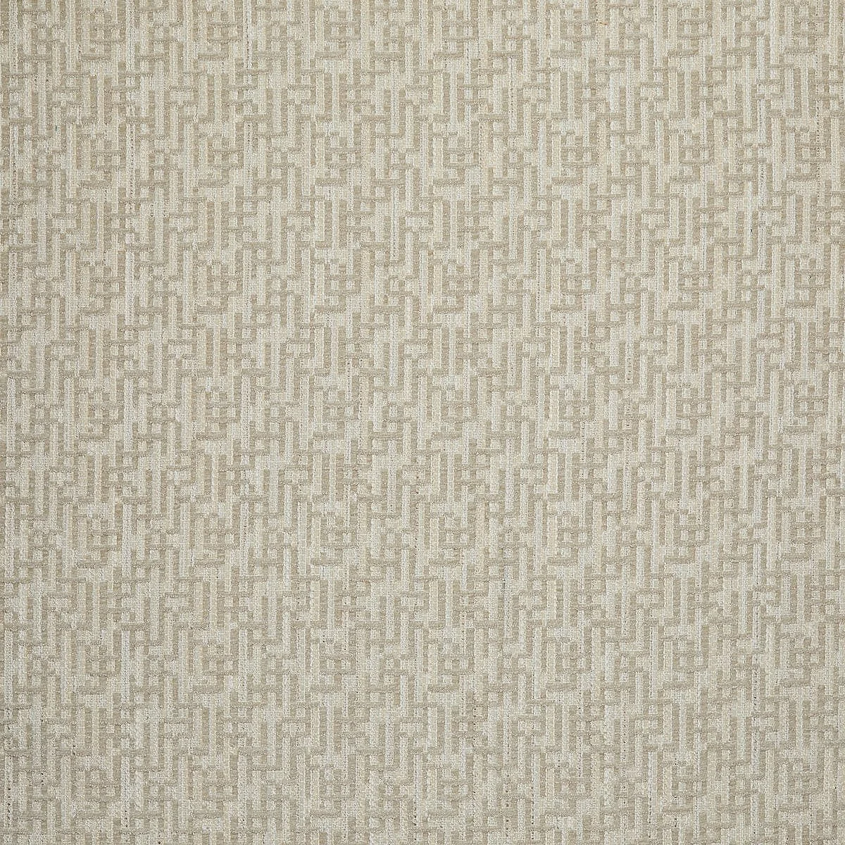 Textured beige woven fabric with a geometric pattern.
