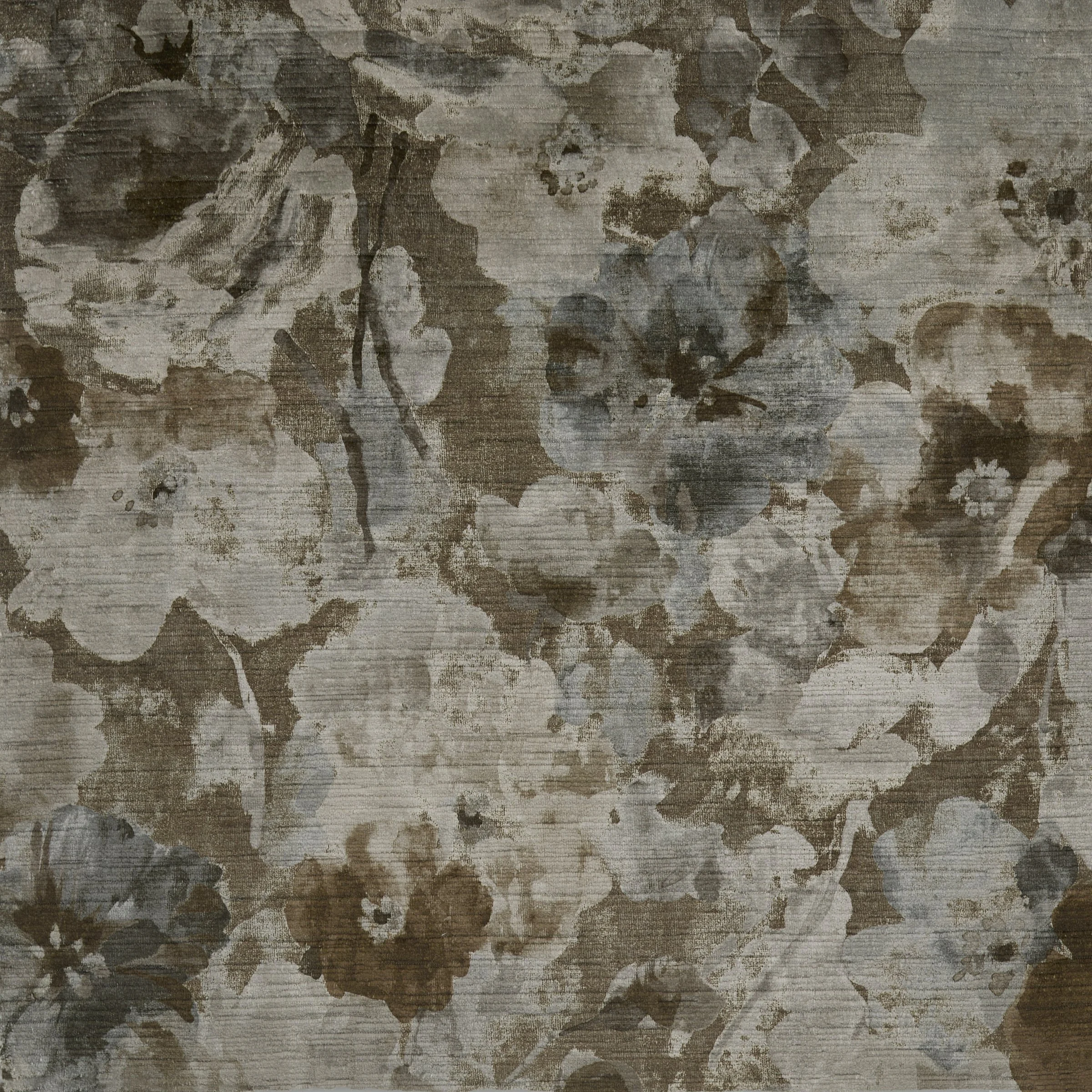 A textured wall with abstract, floral-like patterns in shades of brown, beige, and gray.