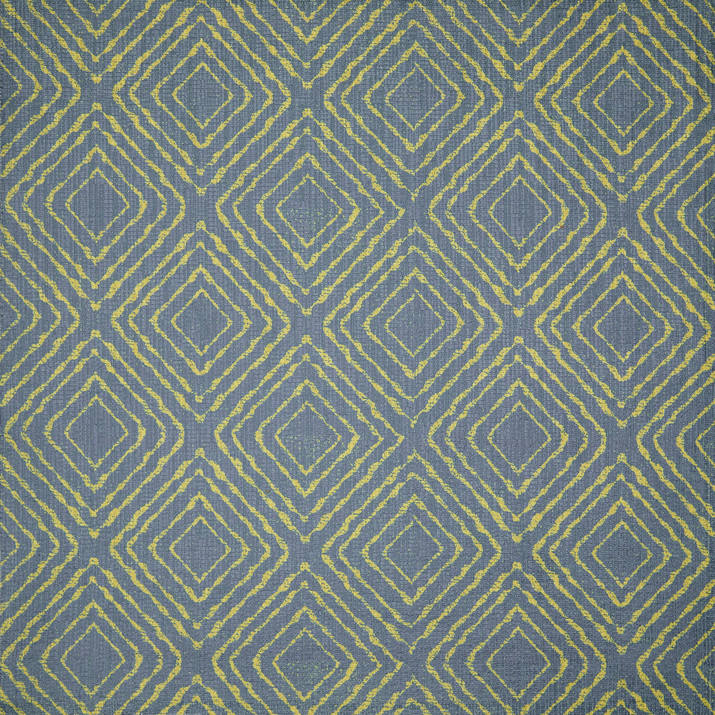 Close-up of a textured fabric with yellow diamond and line patterns on a blue background.