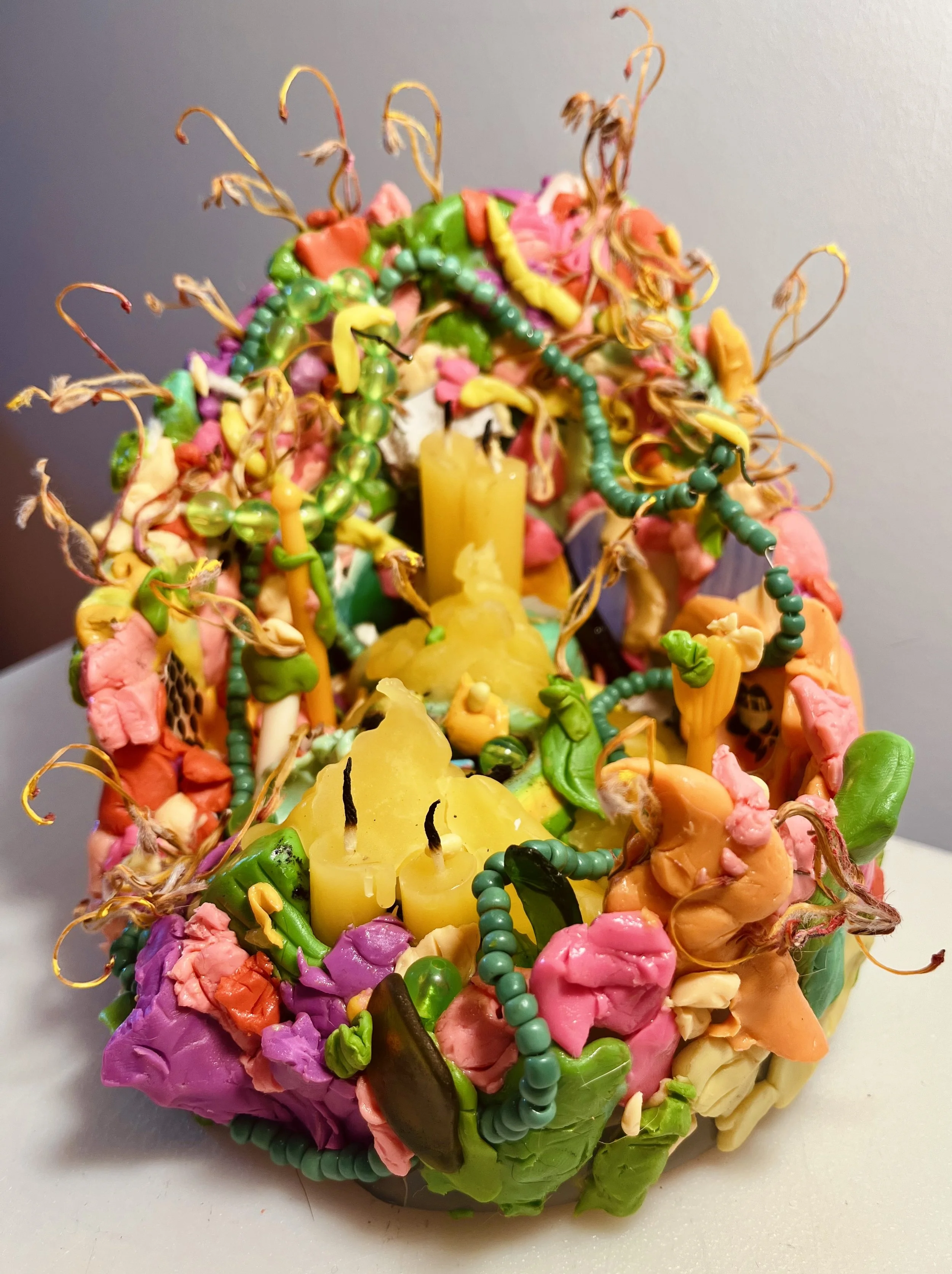  blooming wish 
2024
Sculpture made from recycled glass, polymer clay, wire, beads, candles, paper, and organic matter