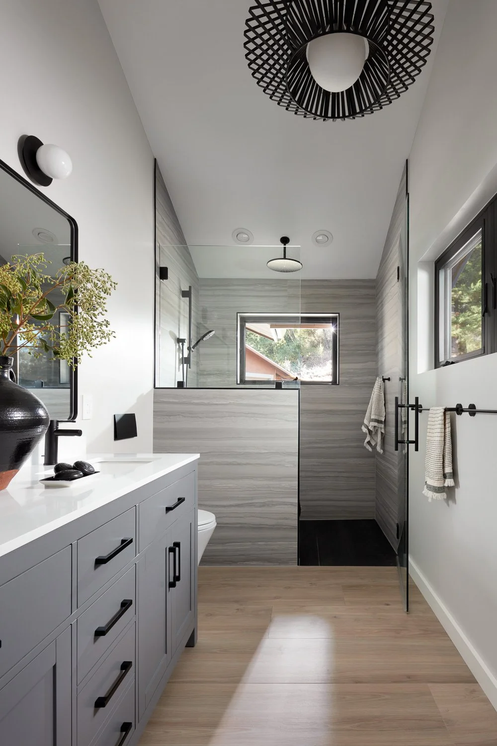 Modern bathroom design blends functionality and style with custom cabinetry, sleek fixtures, and natural light.