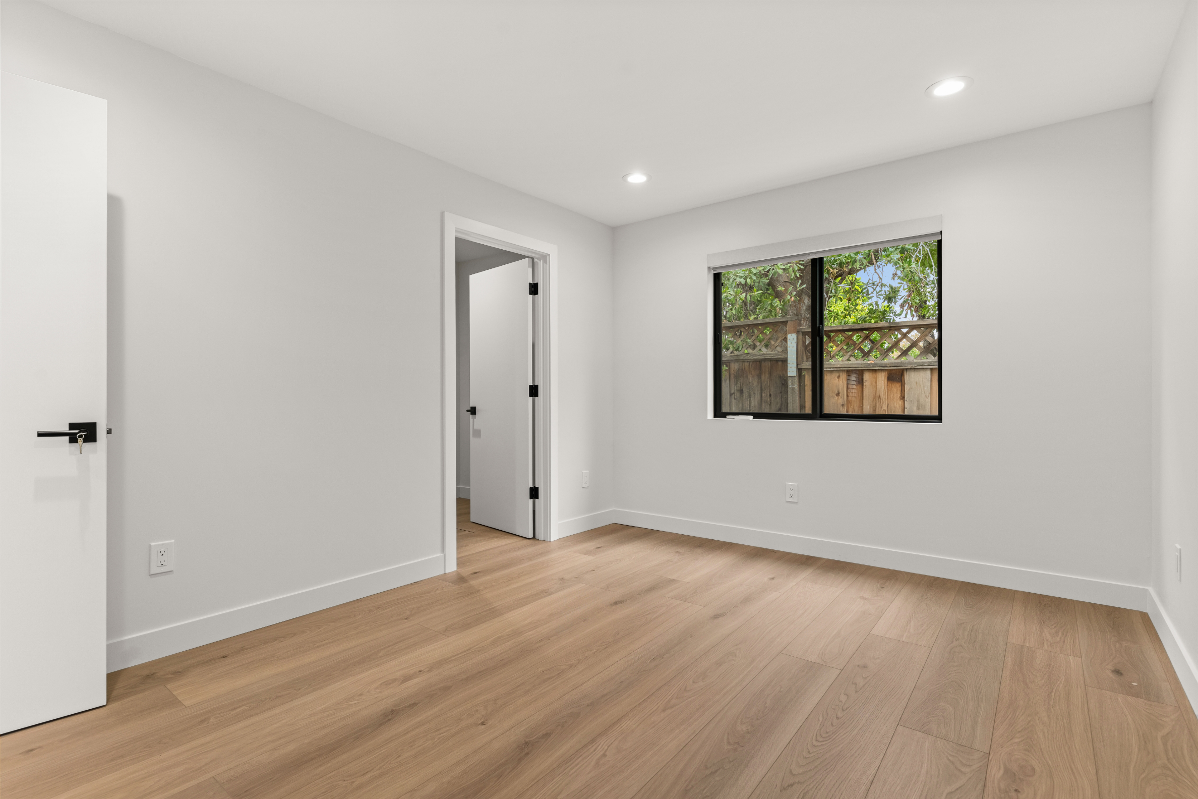 Spacious bedroom in this detached ADU in San Jose featuring abundant natural light and a clean, modern design.
