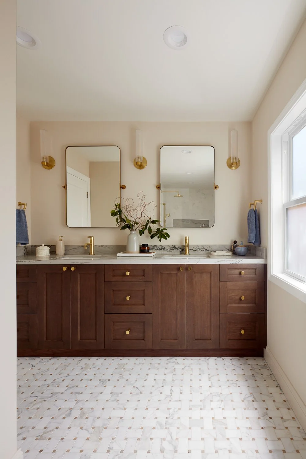 Primary bath with custom double vanity and refined finishes – custom home remodel.