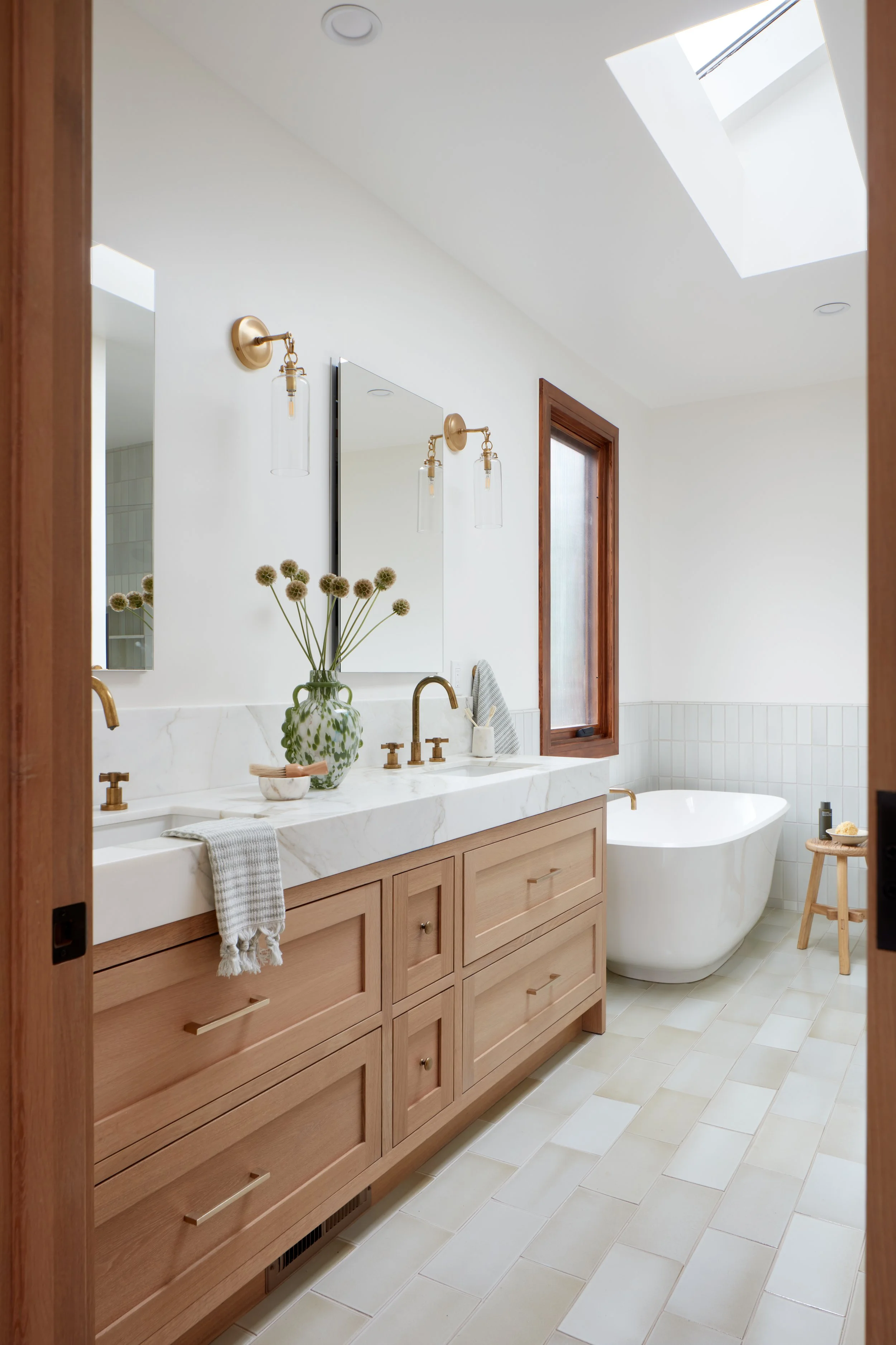 A calming retreat with freestanding tub and skylight—expertly executed by a San Mateo home remodeling contractor.