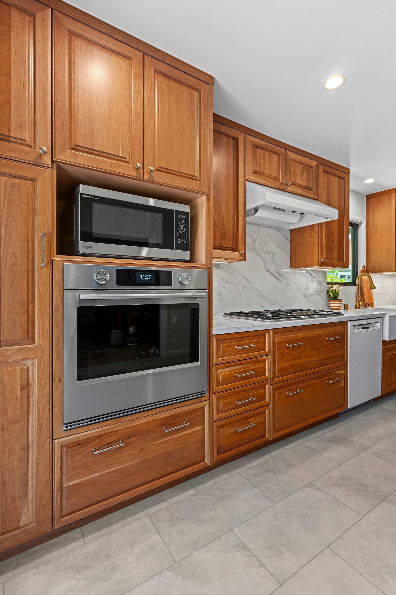 Custom kitchen addition in Los Gatos featuring handcrafted cabinetry, quartz countertops, and abundant storage.
