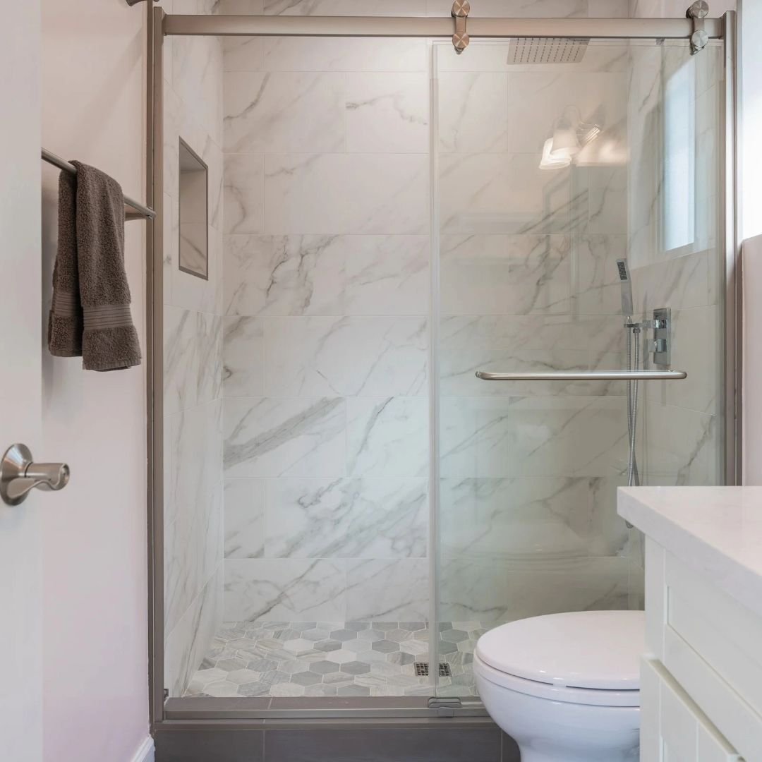 A luxurious, modern bathroom, complete with a stunning walk-in shower adorned in exquisite tiles. Experience elegance and sophistication redefined in our Garage to Adu Conversion in Palo Alto. 

One Stop Shop for All Your Construction Needs! From roo