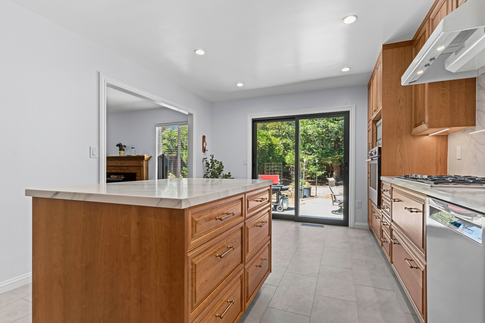 Custom kitchen addition in Los Gatos featuring handcrafted cabinetry, quartz countertops, and abundant storage.
