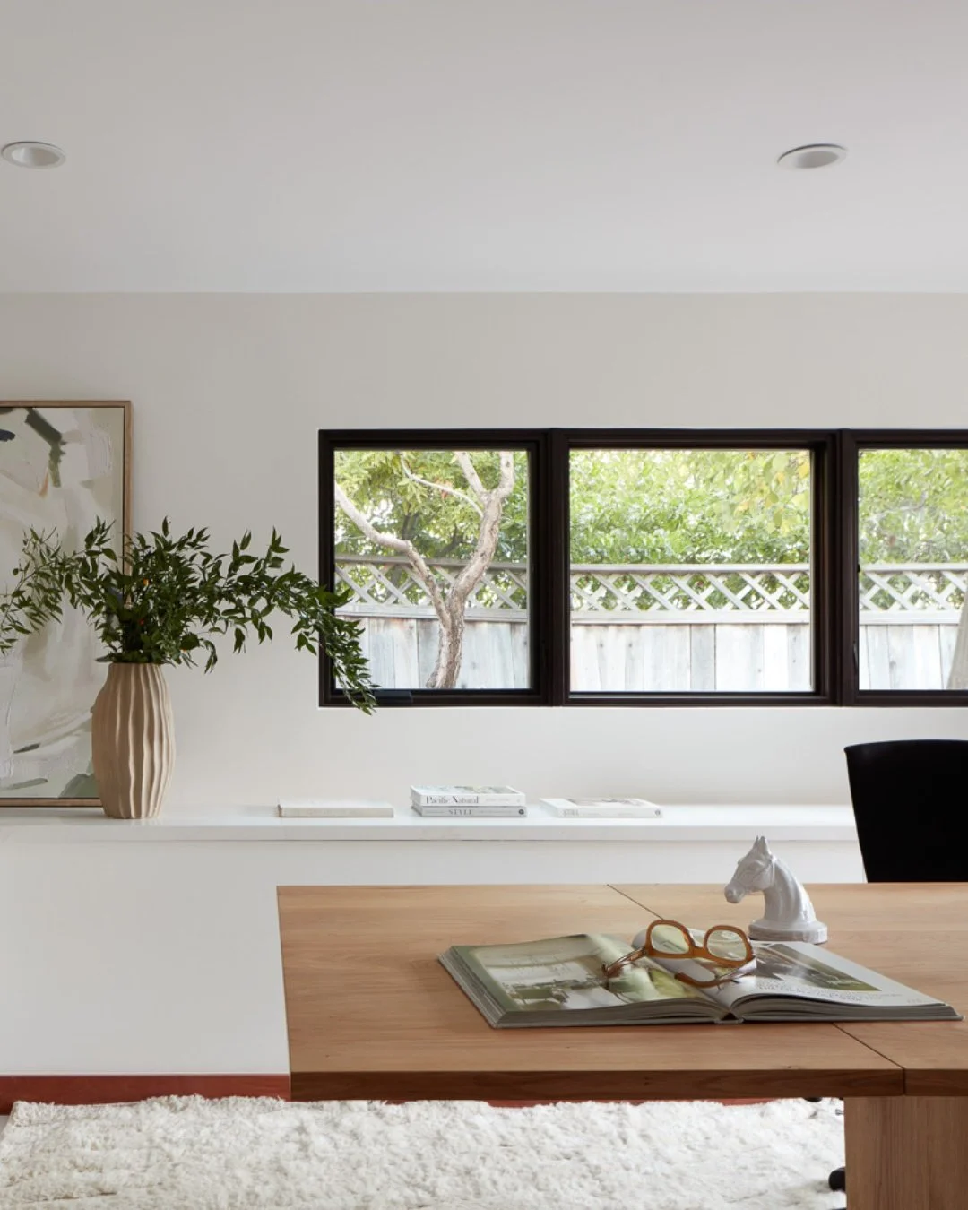 A home office should be an inspiring, clutter-free sanctuary that sparks focus and creativity. This thoughtfully styled workspace strikes the perfect balance between clean architectural lines and warm, organic elements that make working from home a t