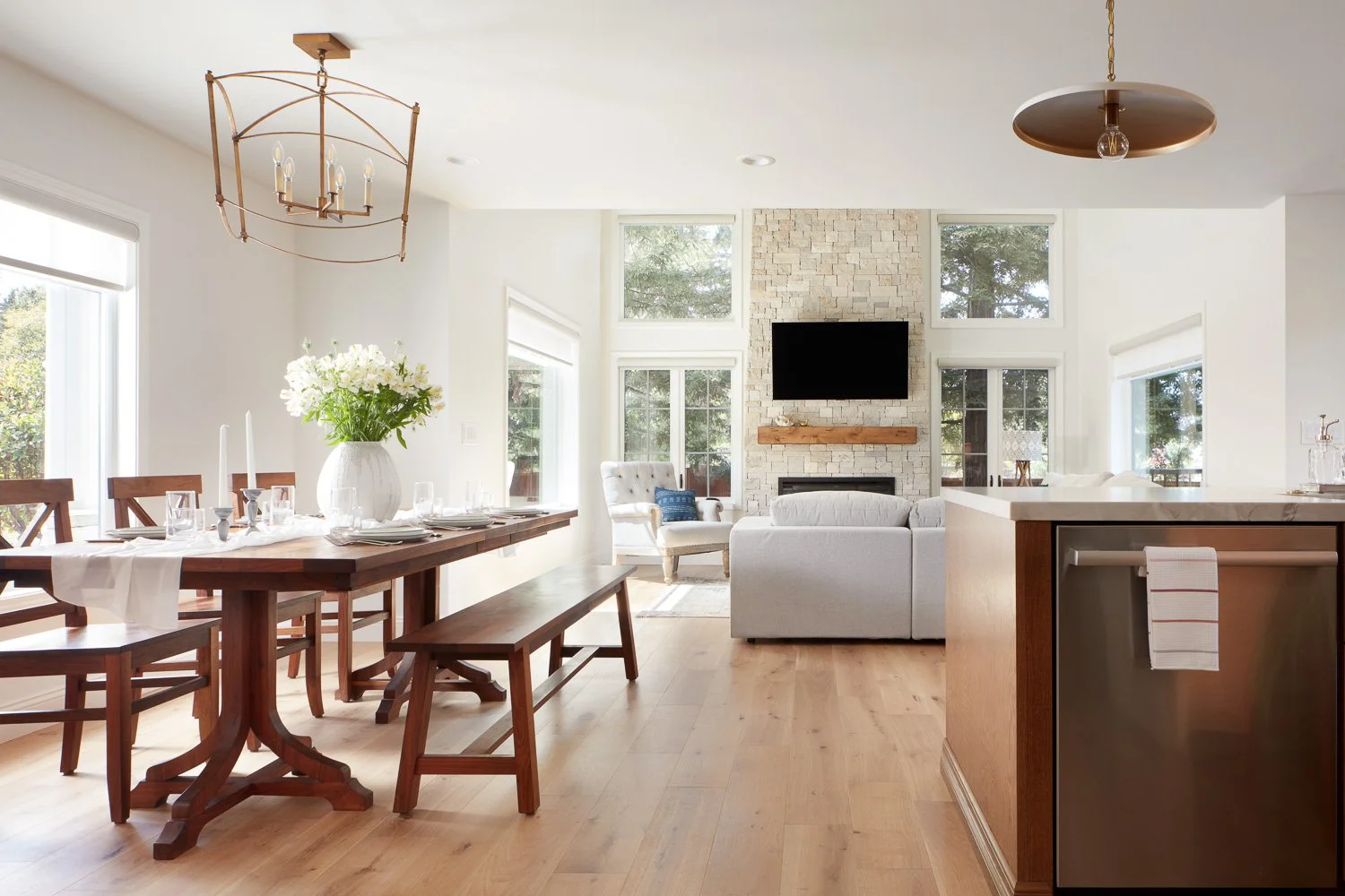 Seamless dining and living flow with vaulted ceilings – custom home remodel.