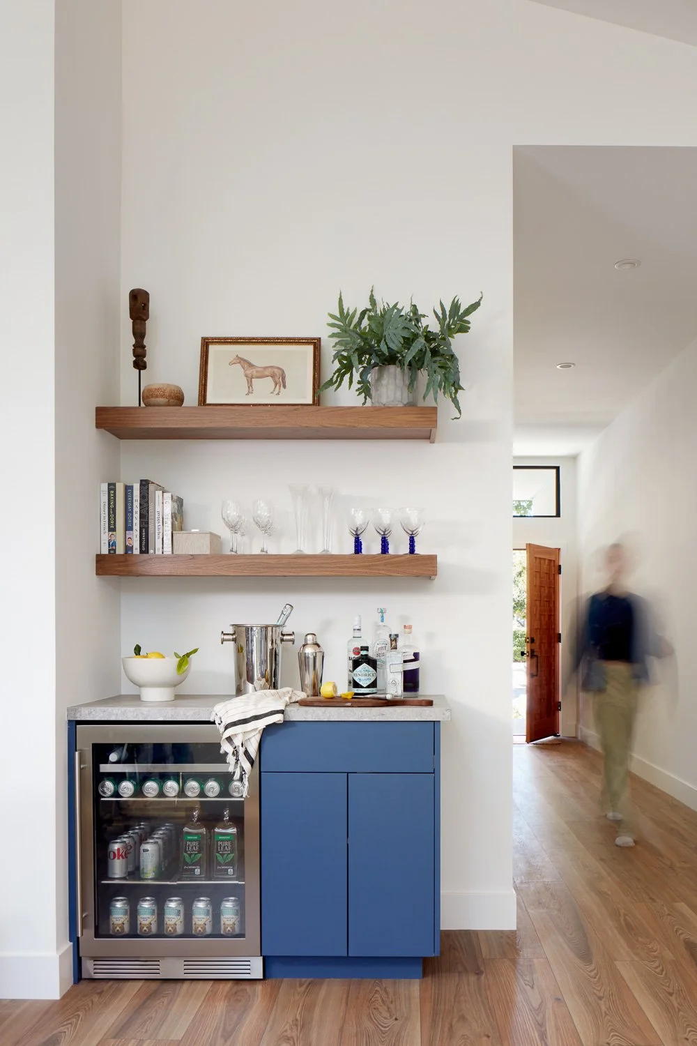 Custom built-in bar with open shelving, designed for everyday convenience within this modern new construction home.