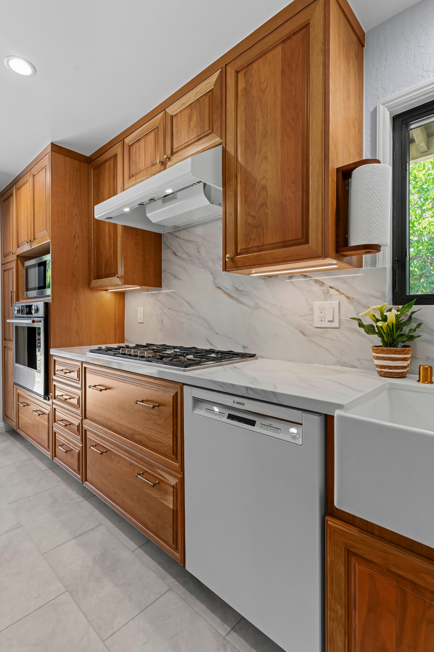 Custom kitchen addition in Los Gatos featuring handcrafted cabinetry, quartz countertops, and abundant storage.