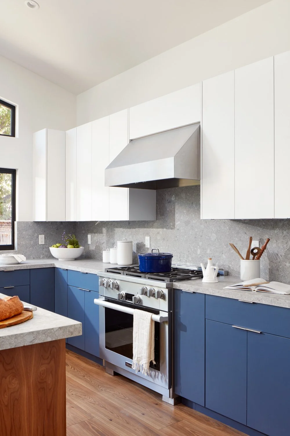 Clean lines and high-end finishes define this chef’s kitchen in a custom new construction residence. 