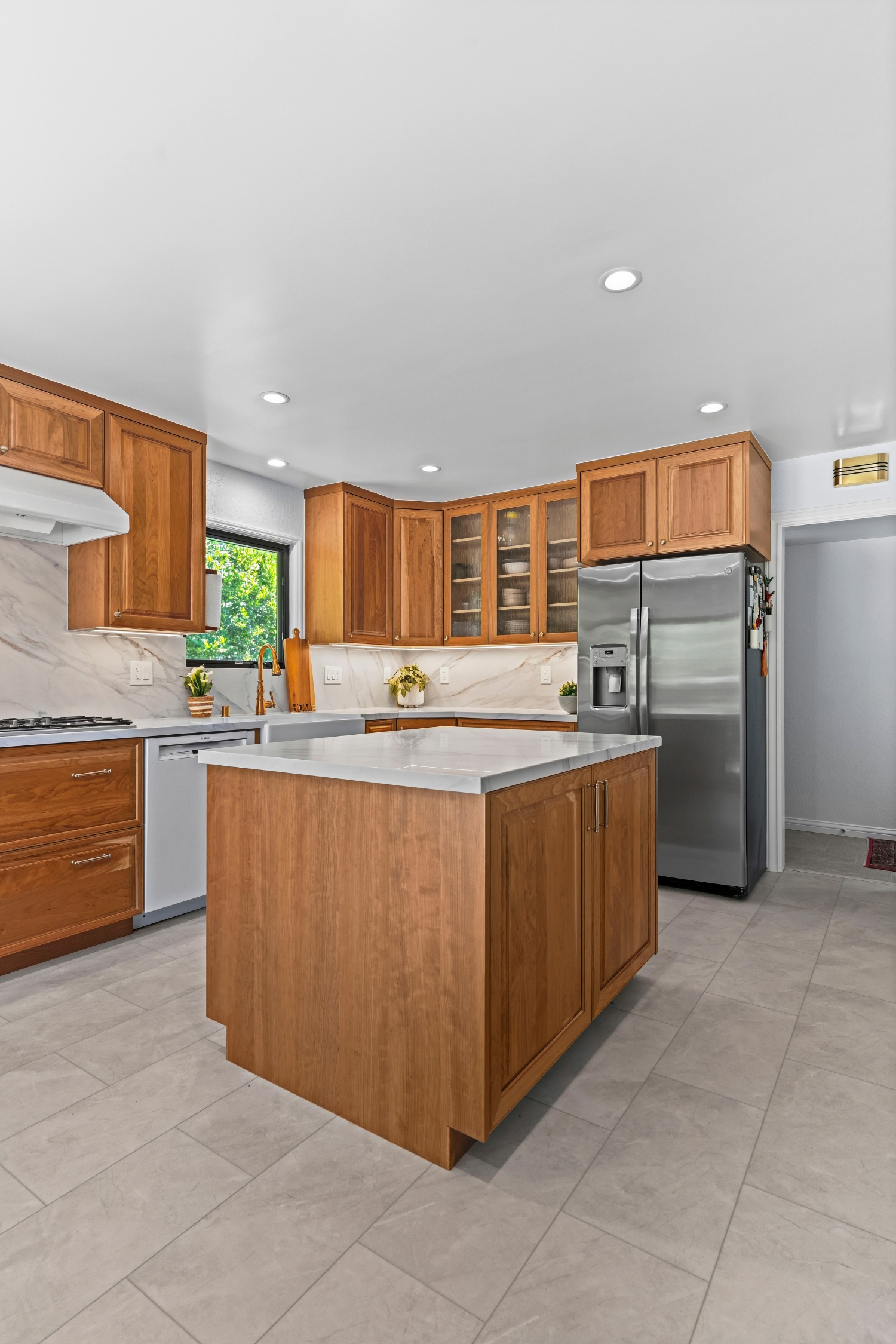 Custom kitchen addition in Los Gatos featuring handcrafted cabinetry, quartz countertops, and abundant storage.