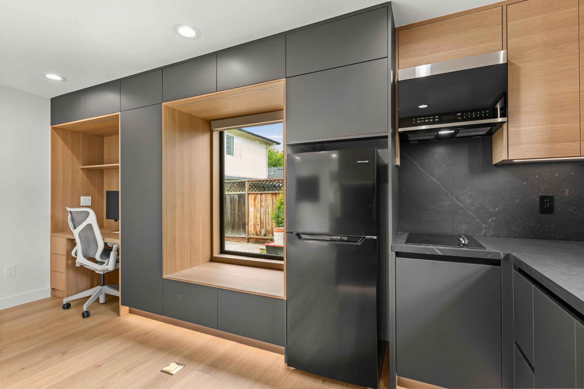 Detached ADU in San Jose with custom cabinetry, a cozy window seat, and a sleek modern kitchen.