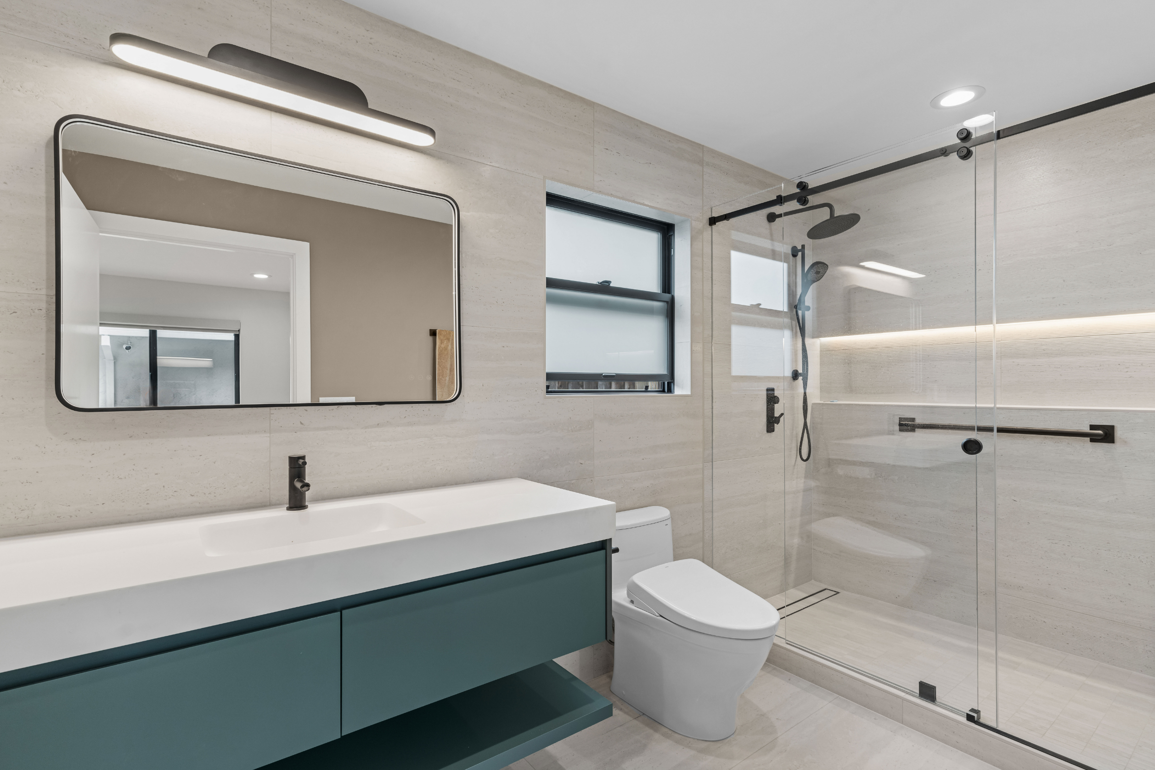 Modern detached ADU bathroom in San Jose with a curbless shower, floating vanity, and designer finishes.