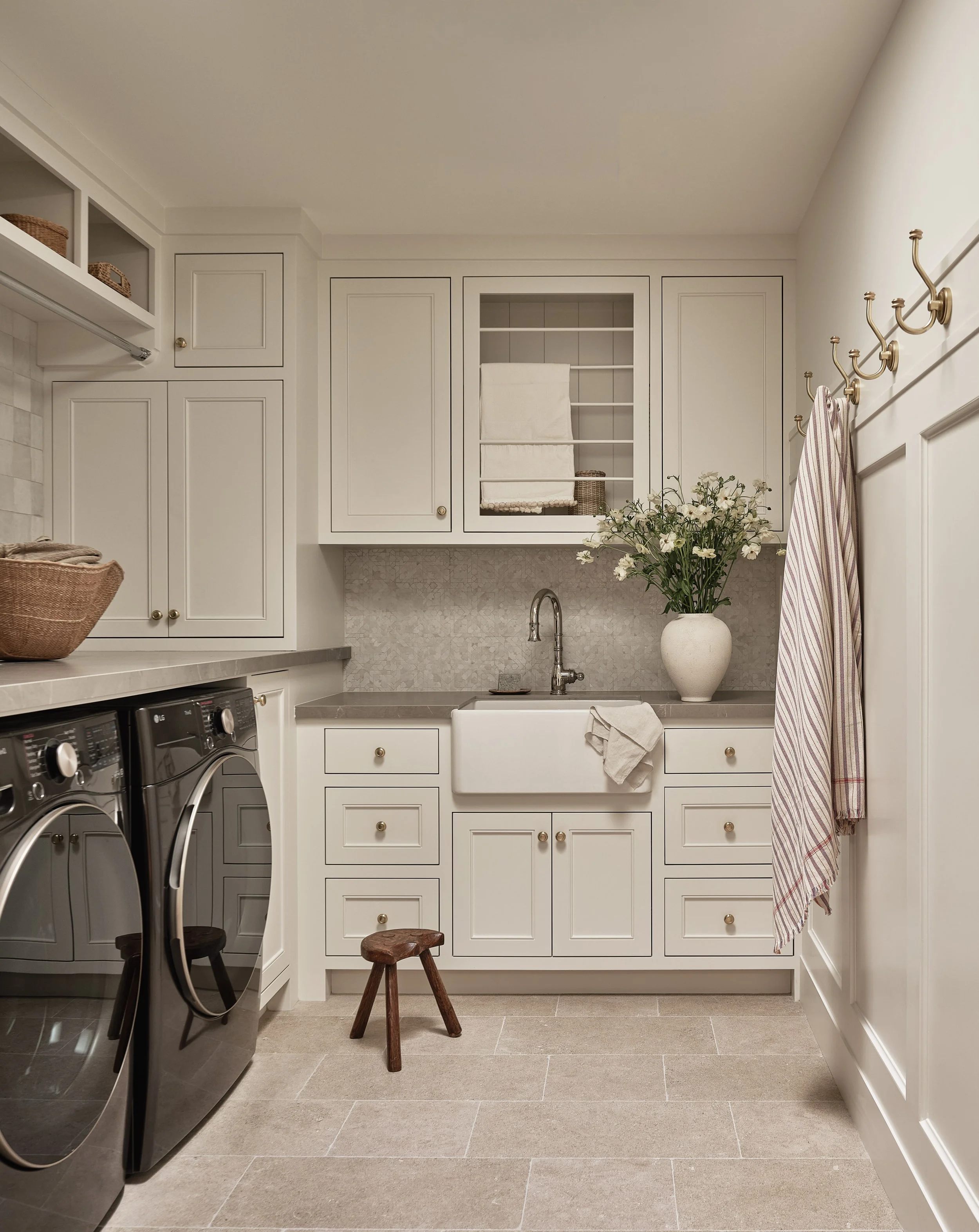 Clean and functional laundry room with custom storage in this Addition & Full Home Remodel.