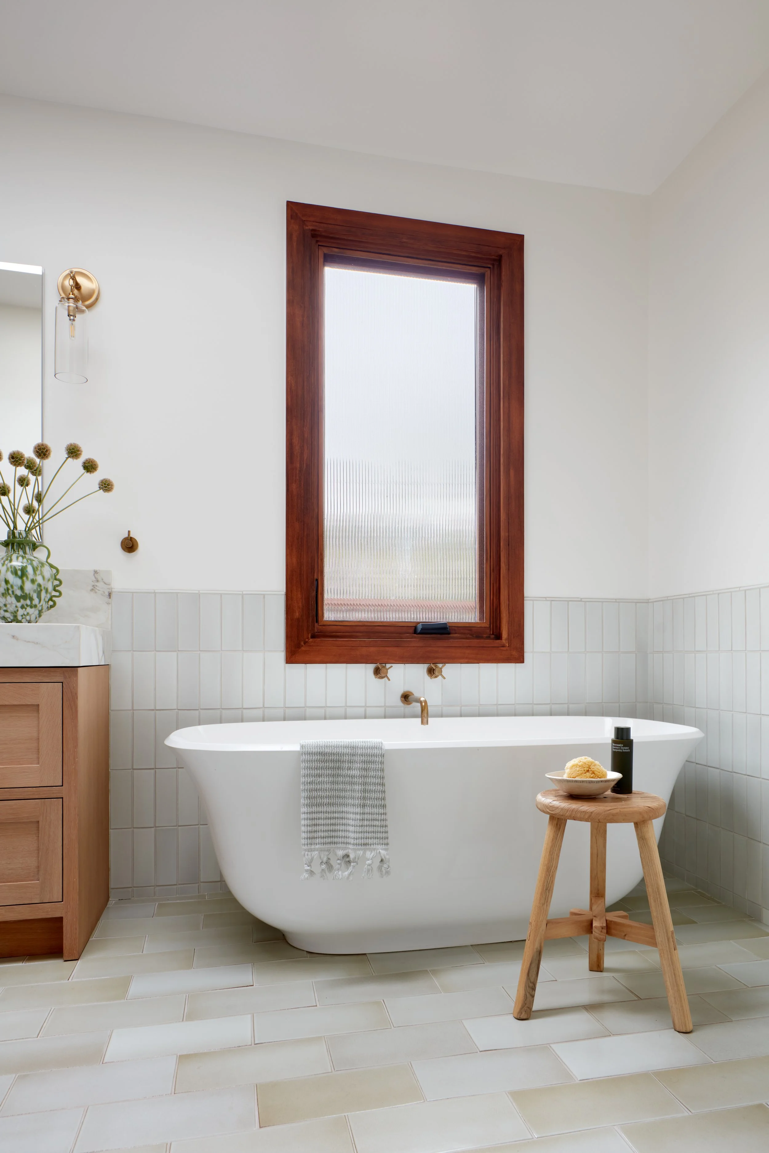 Freestanding soaking tub + warm wood trim—your daily reset, elevated in this San Mateo luxury renovation.