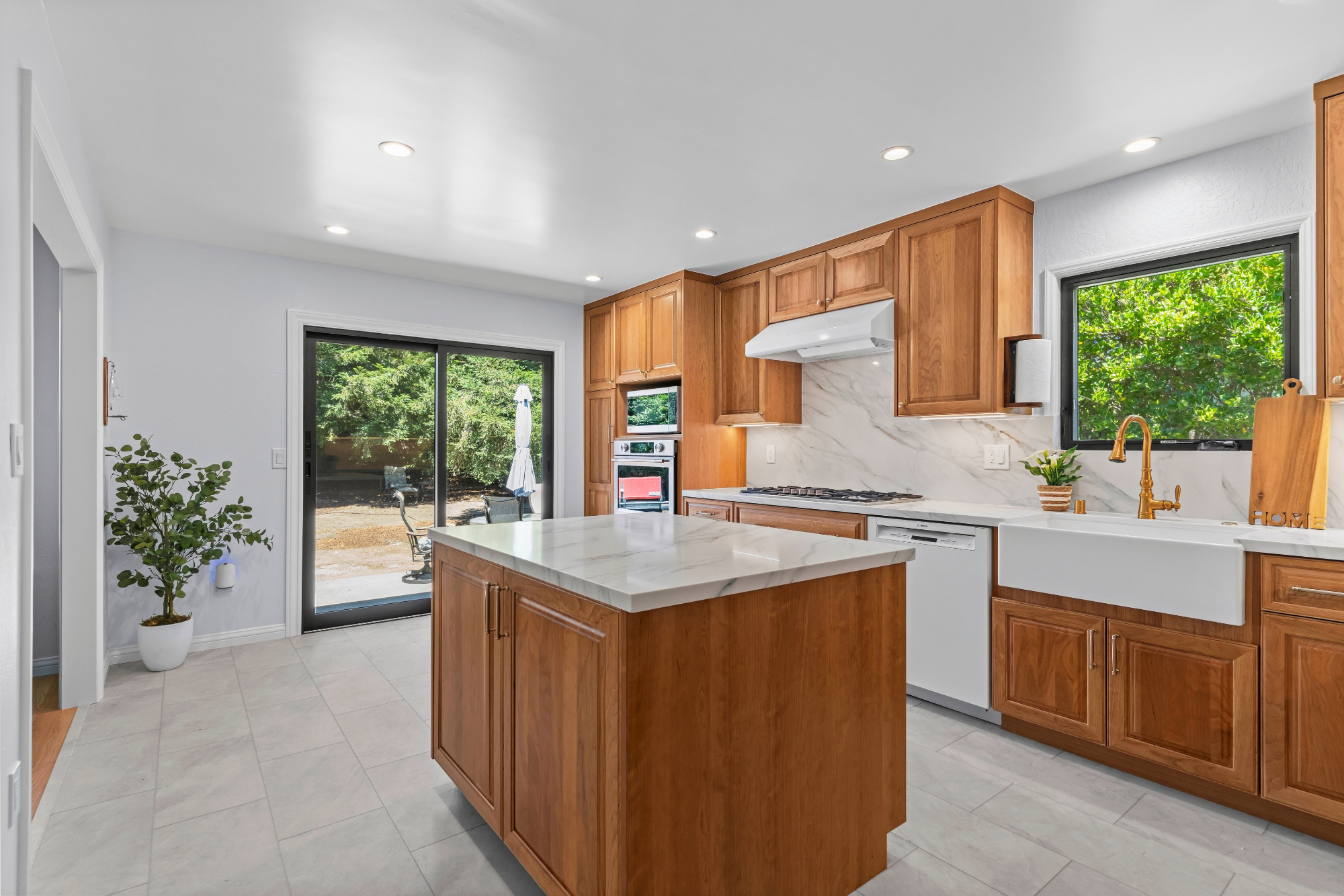 Custom kitchen addition in Los Gatos featuring handcrafted cabinetry, quartz countertops, and abundant storage.