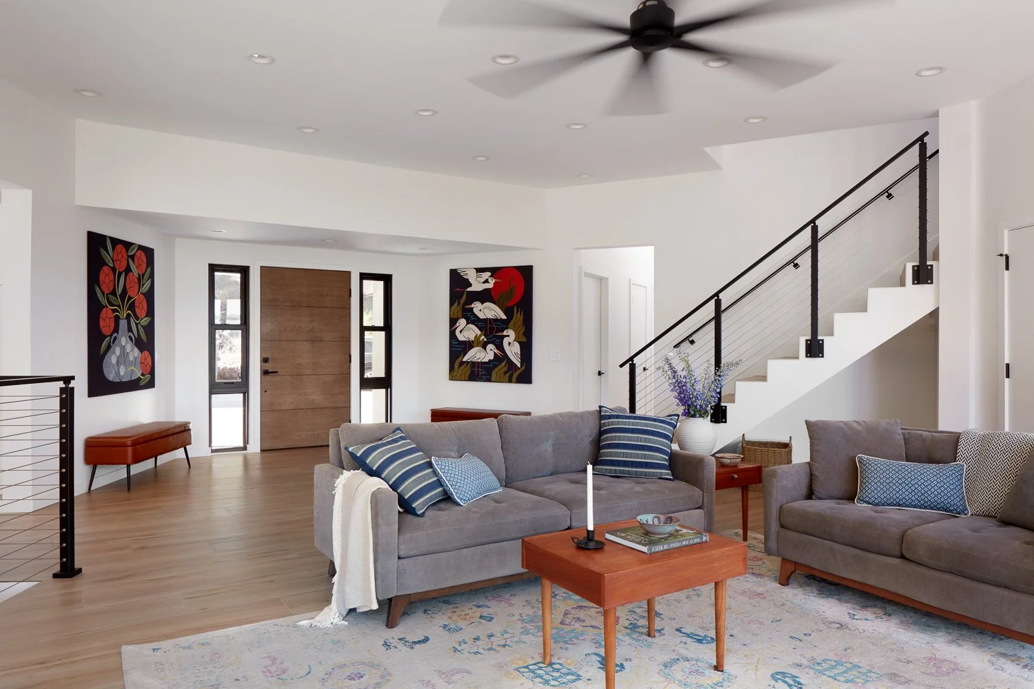 Clean lines, open sightlines, and thoughtful details define this inviting main living area of the custom rebuild.