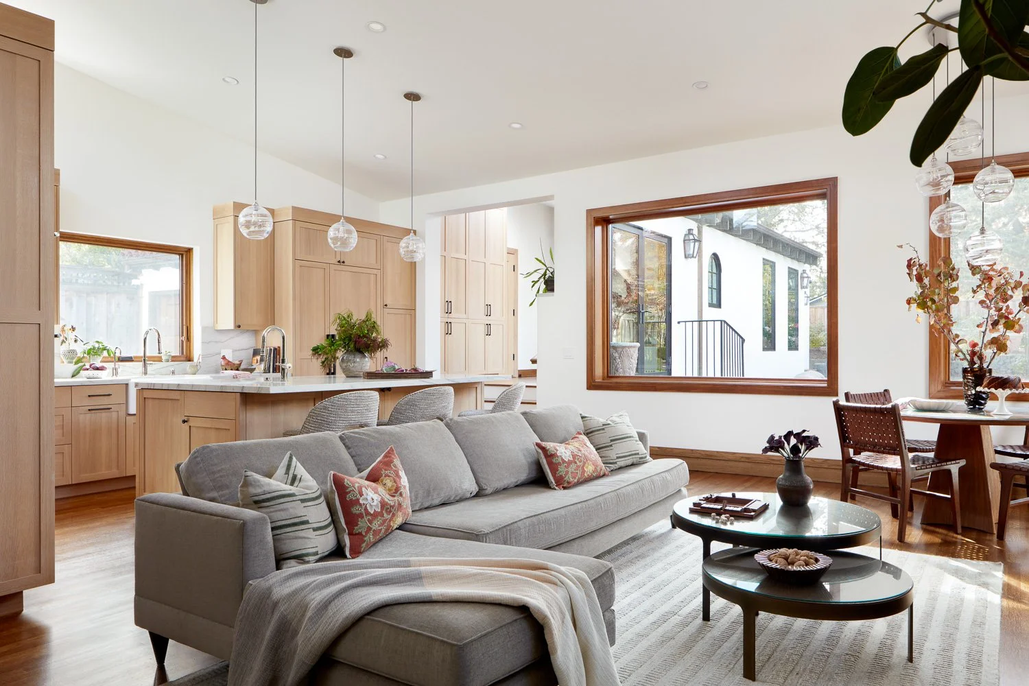 Open-concept living room and kitchen remodel with natural light, custom cabinetry, and seamless flow—ideal for entertaining.