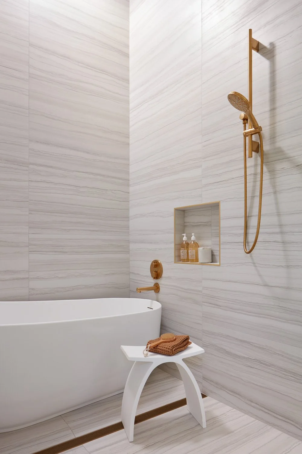 Refined shower details elevate everyday routines with custom niches, elegant finishes, and clean lines.