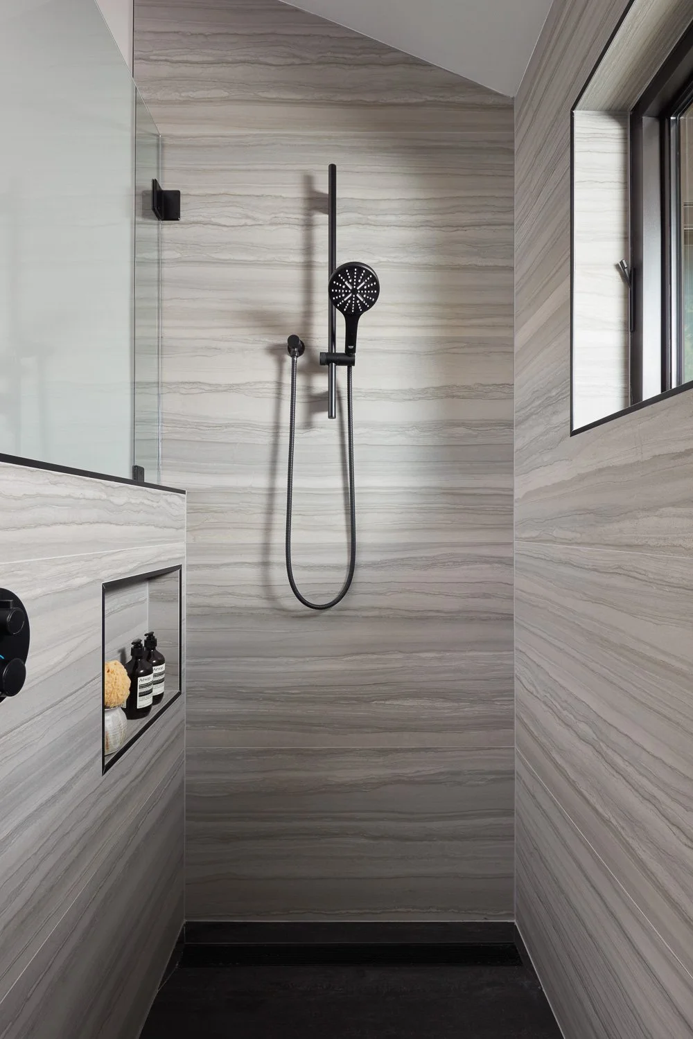 A spa-inspired shower with sleek finishes and calm textures, designed for daily comfort and timeless style.