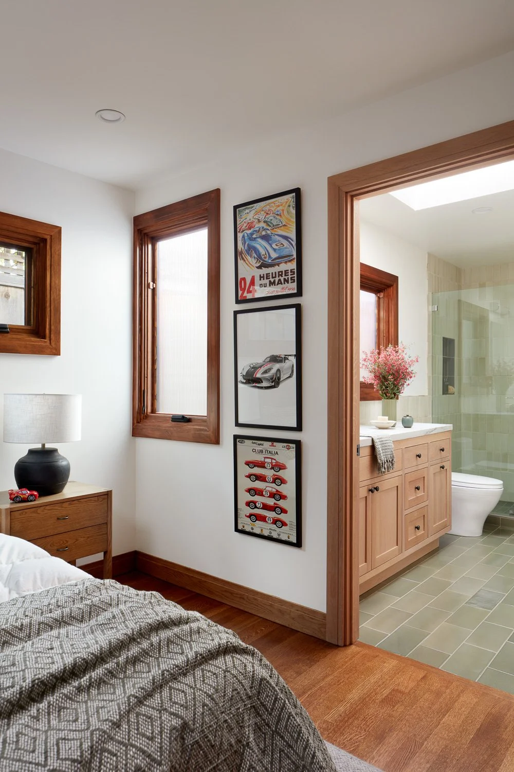 Warm wood details and seamless flow from bedroom to bathroom, showcasing thoughtful space planning in this luxury full home remodel.