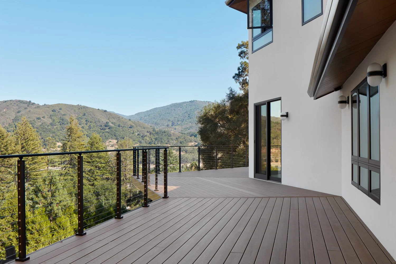 Built for the view. Expansive decking creates a seamless connection between the home and the surrounding hills.