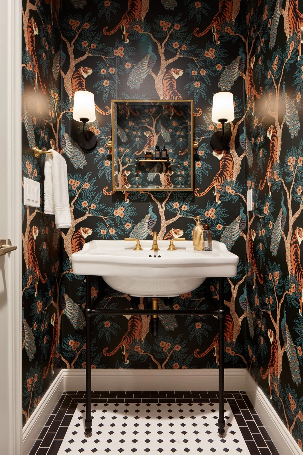 Luxury powder bath with statement wallpaper and floating sink – custom home remodel.