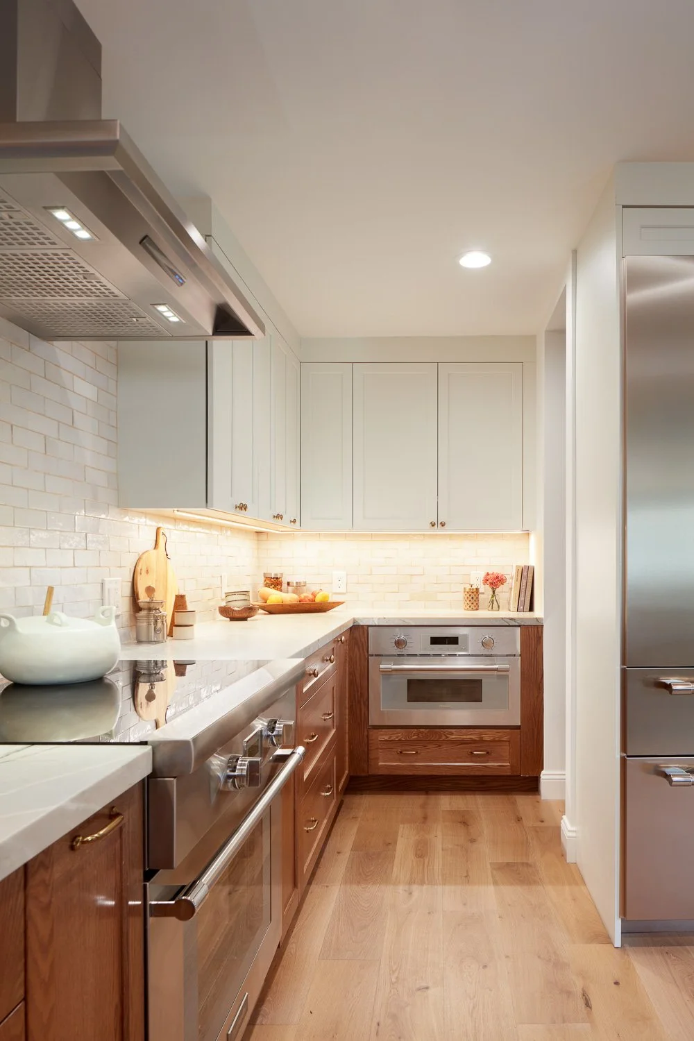 Functional kitchen layout with premium appliances and storage – custom home remodel.