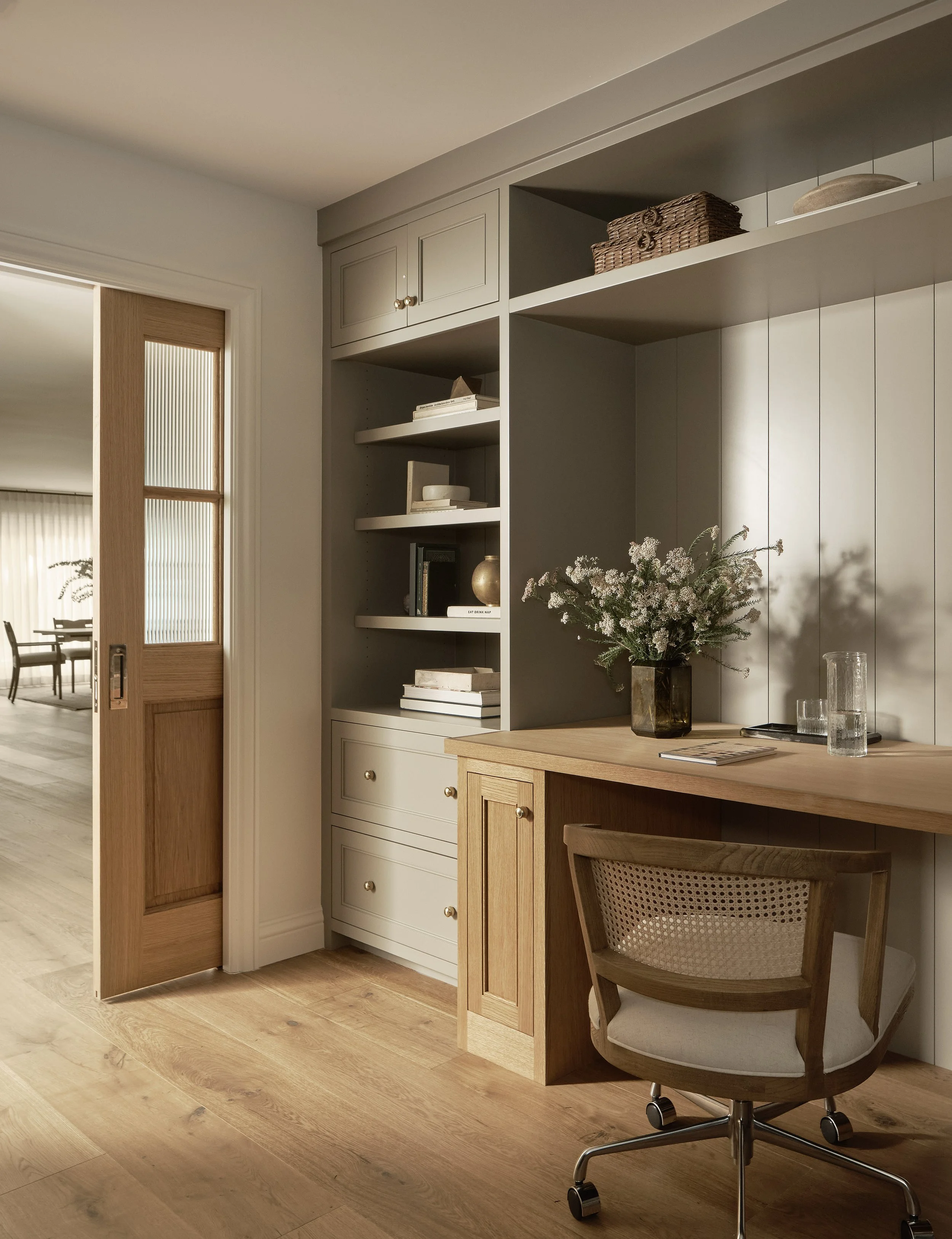 Custom built-in workspace with shelving and integrated storage in this Addition & Full Home Remodel.