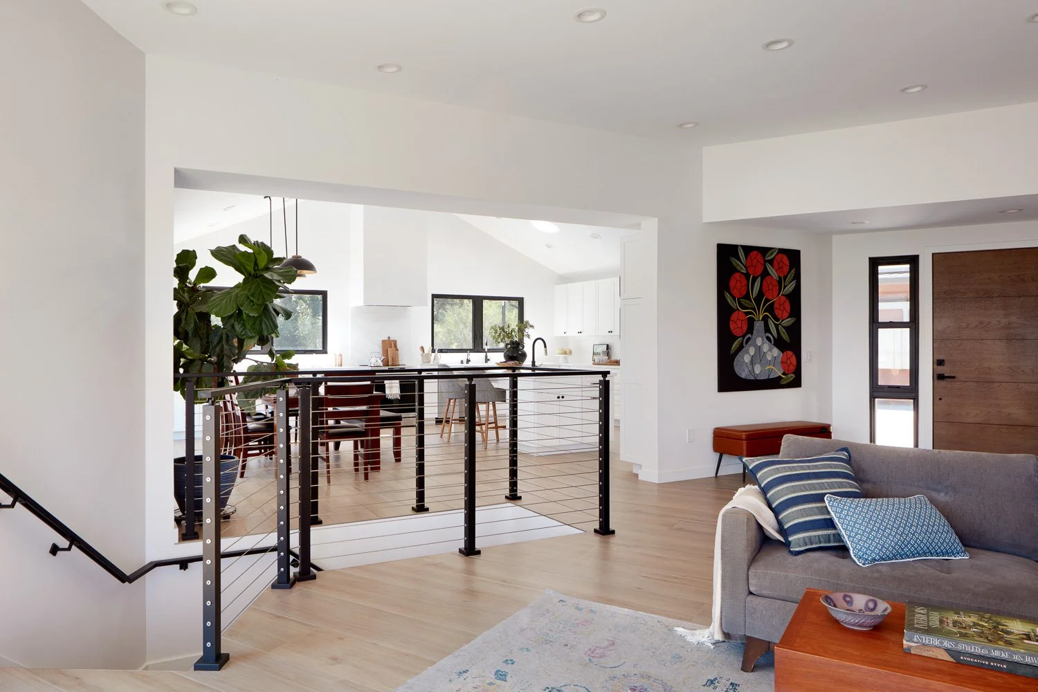 Seamless connection between living and kitchen spaces, creating an open flow ideal for modern family life.