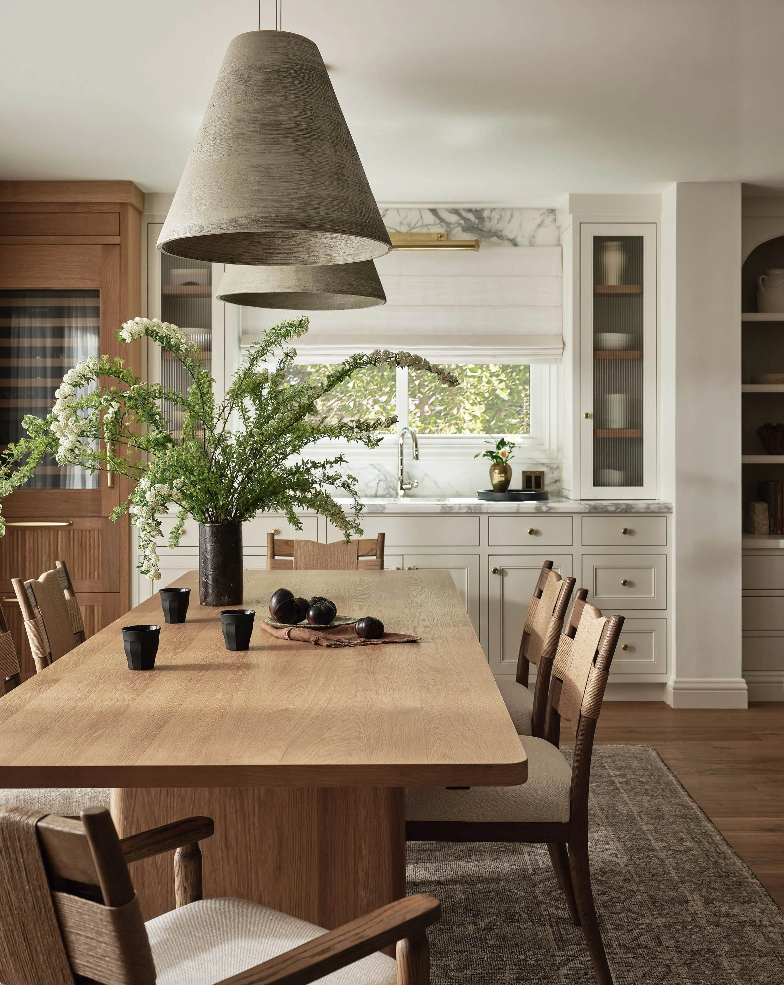 Modern pendant lighting and clean lines elevate this dining room in this Addition & Full Home Remodel in Santa Clara.
