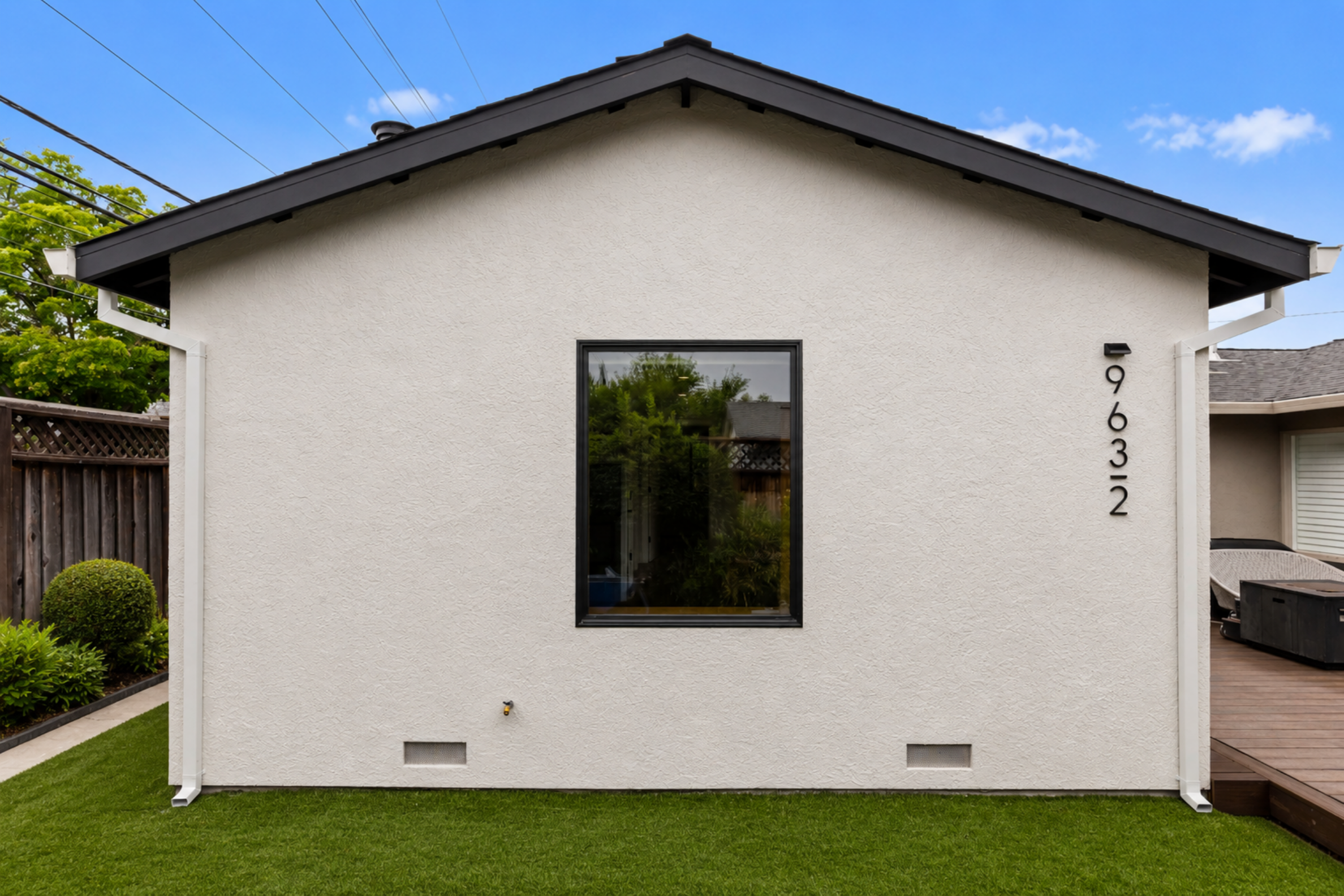 Front view of this detached ADU in San Jose with modern stucco, black windows, and clean architectural lines.
