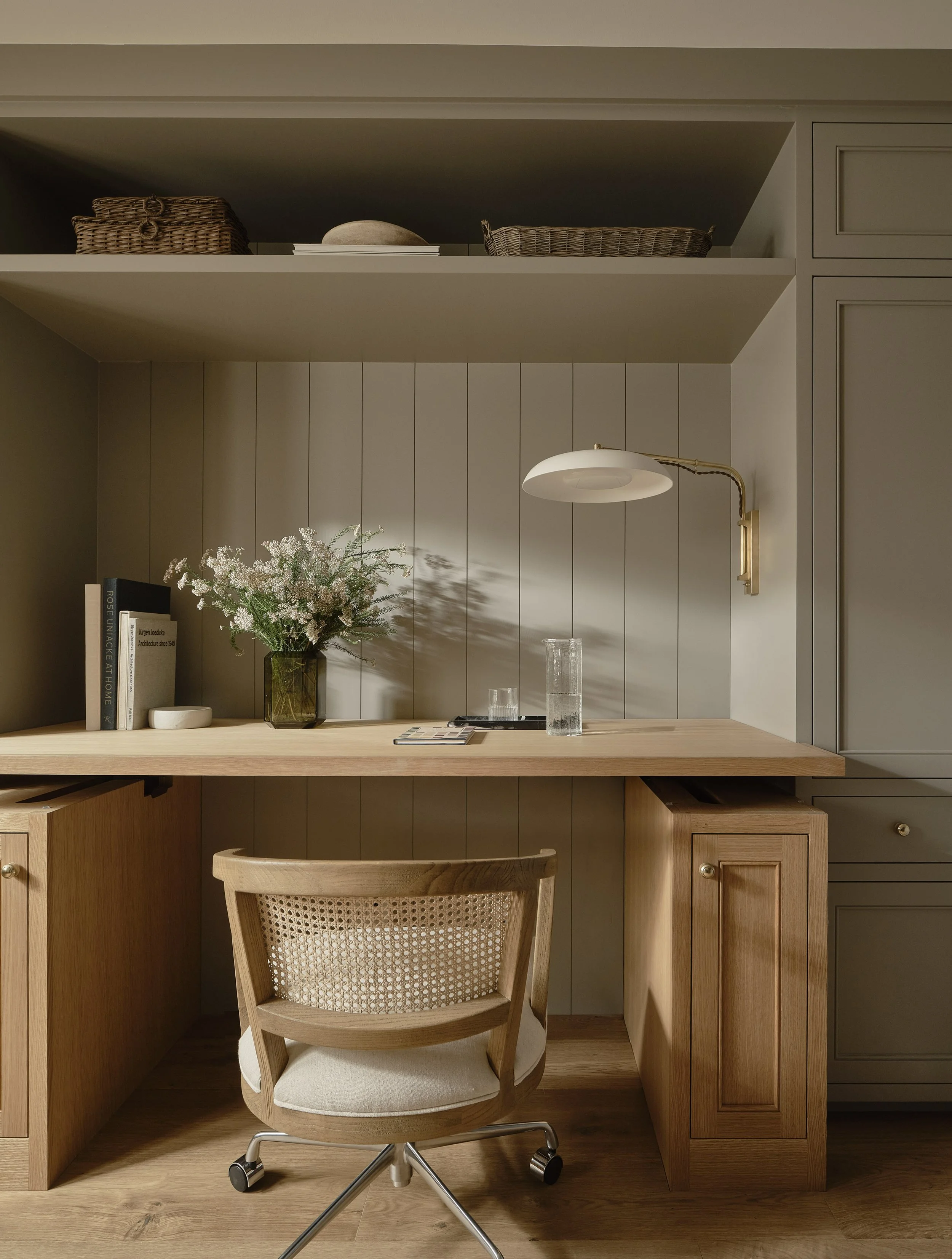 Custom cabinetry and open shelving provide seamless storage in this Addition & Full Home Remodel.