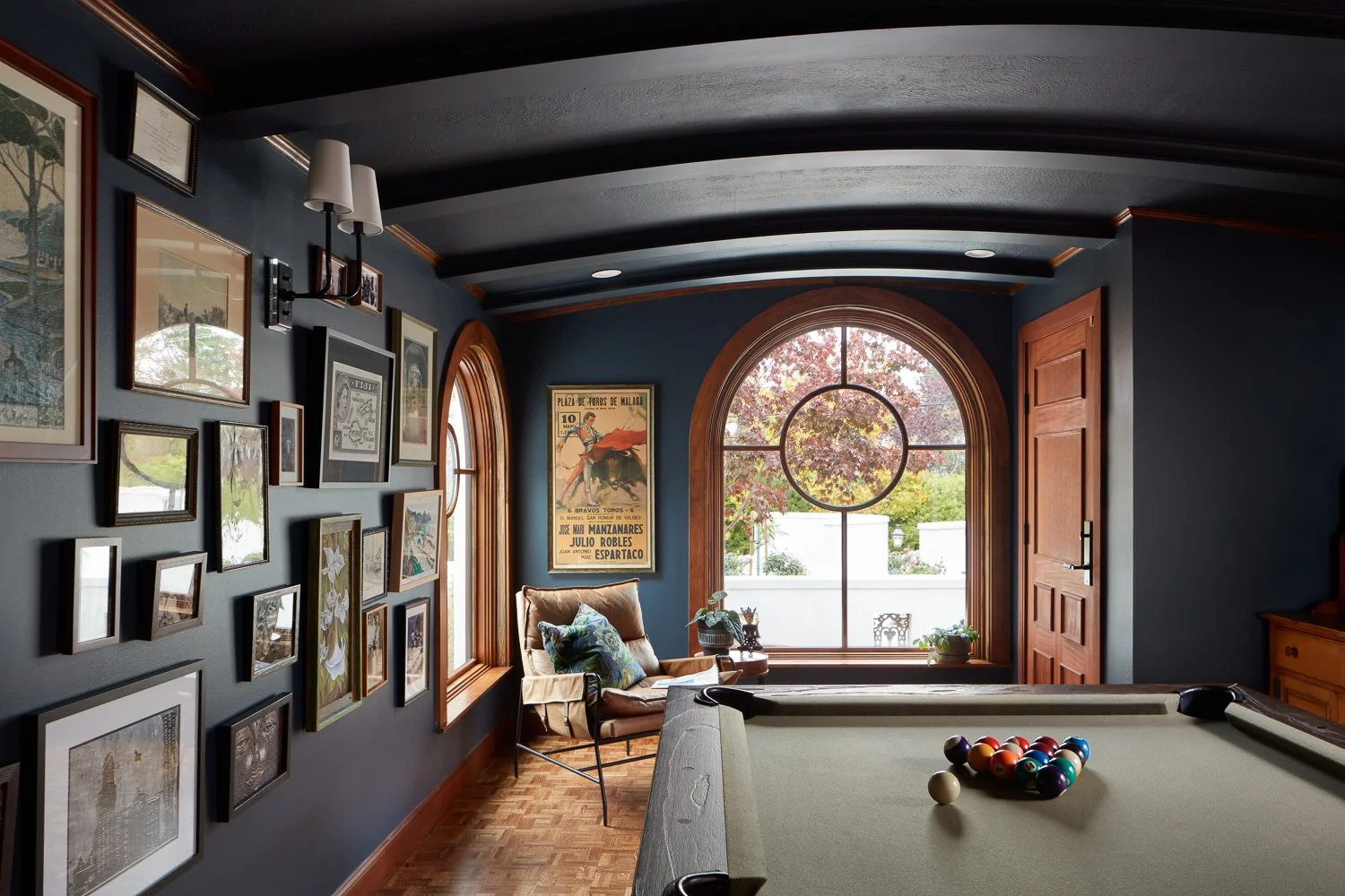 Moody, sophisticated, and built for gathering—this pool room blends vintage character with modern comfort.