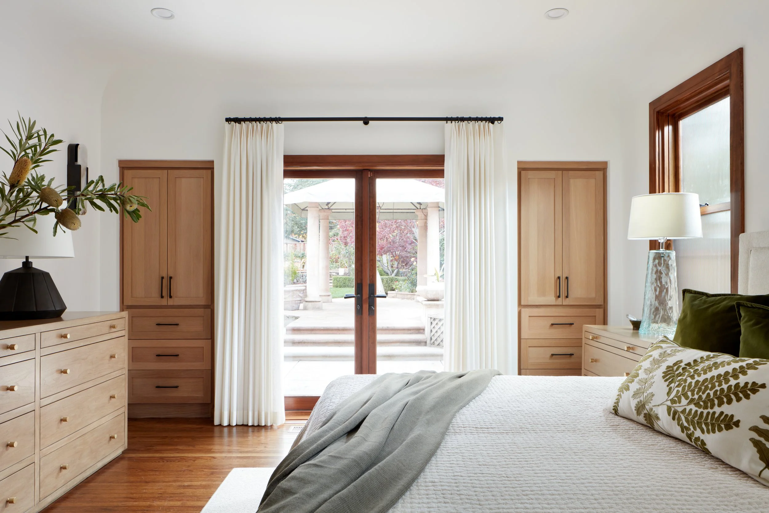 Open-concept bedroom with custom millwork and natural light, part of a high-end San Mateo home remodel.